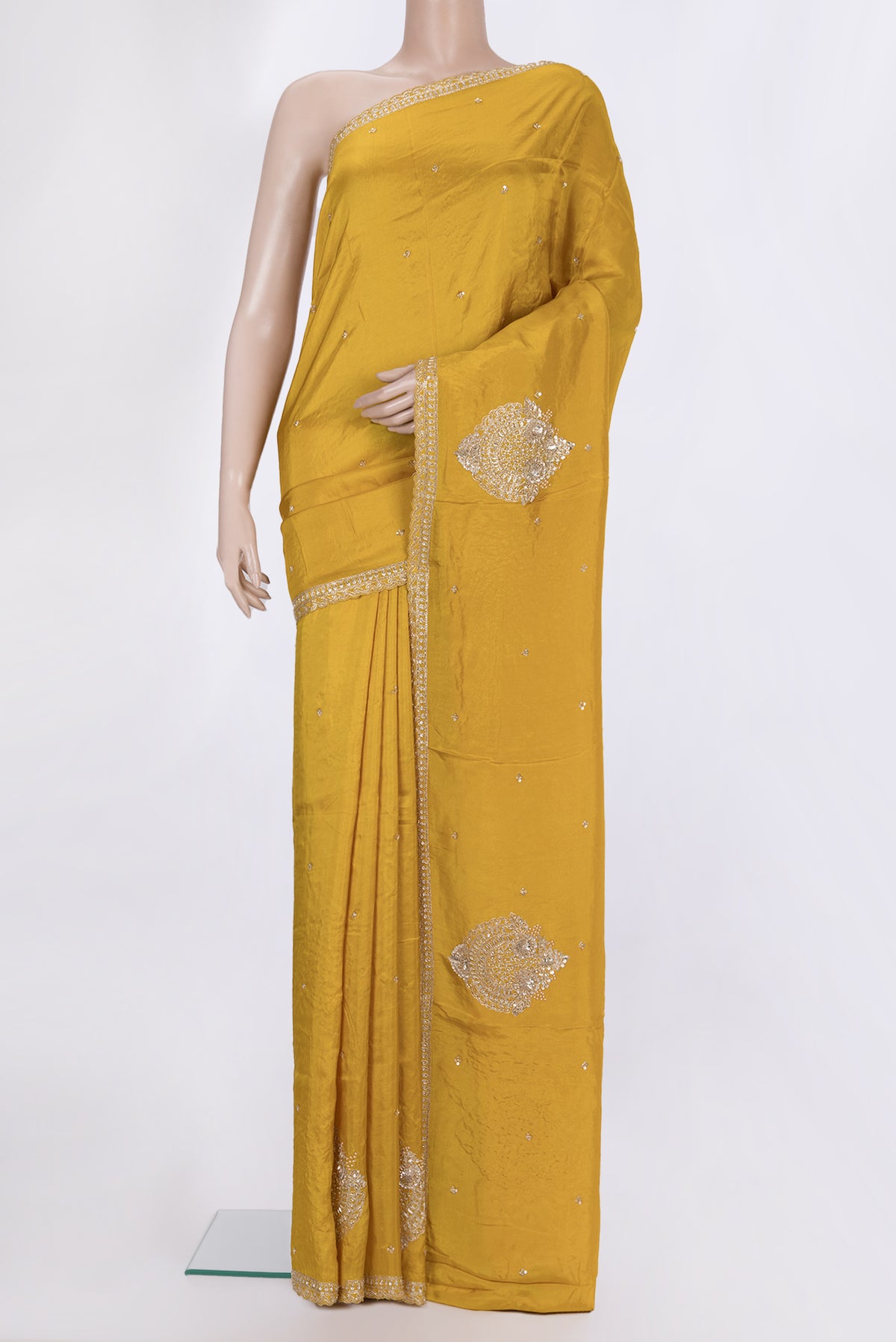 Yellow Crepe Saree with Embroidered on the body and Embroidered Border.  displayed on a mannequin