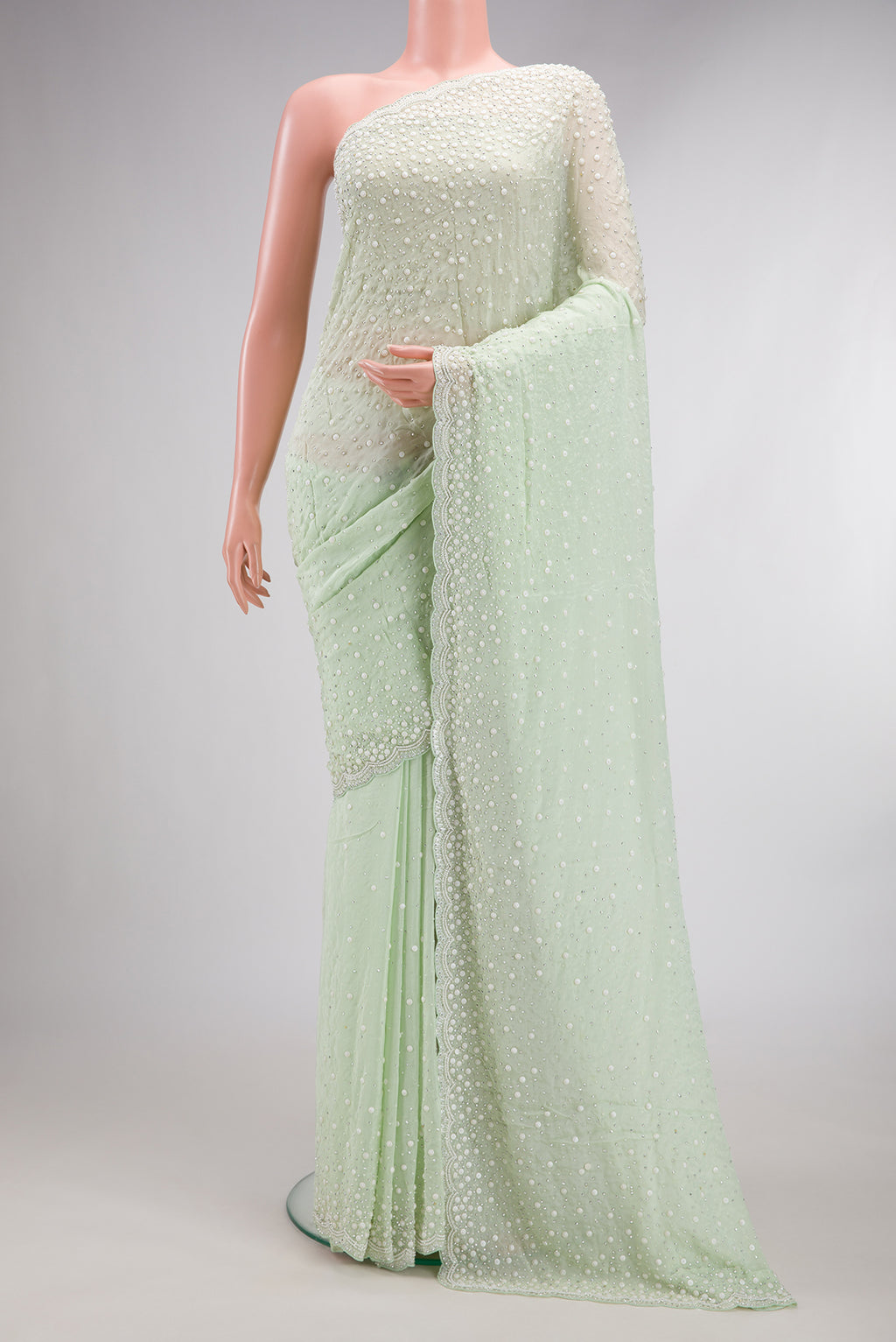 Light Green Dual Tone Mysore Georgette Saree with Embroidered on the body and Sequin Border.  displayed on a mannequin