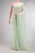 Light Green Dual Tone Mysore Georgette Saree with Embroidered on the body and Sequin Border.  displayed on a mannequin