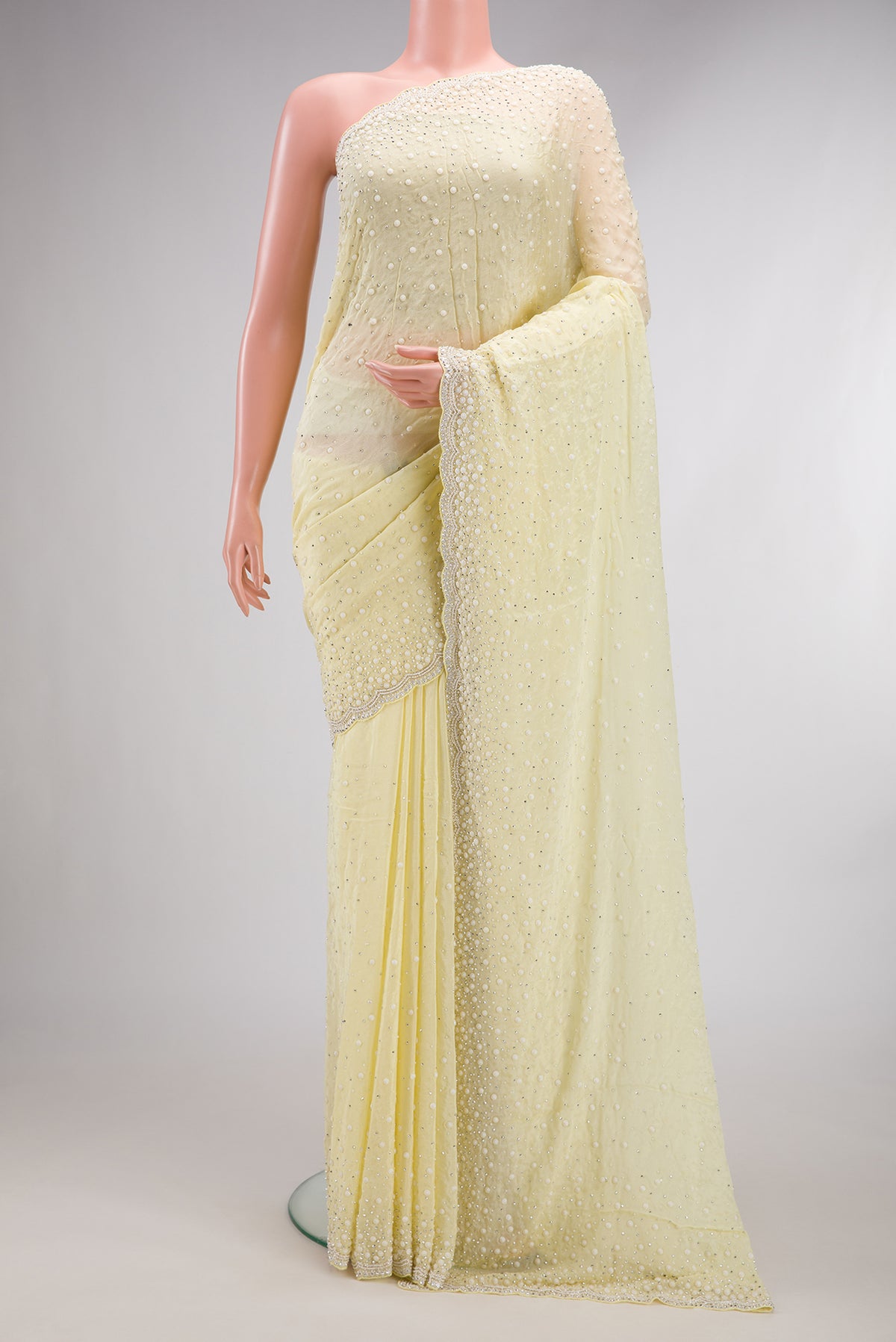 Sandal Dual Tone Mysore Georgette Saree with Embroidered on the body and Sequin Border.  displayed on a mannequin