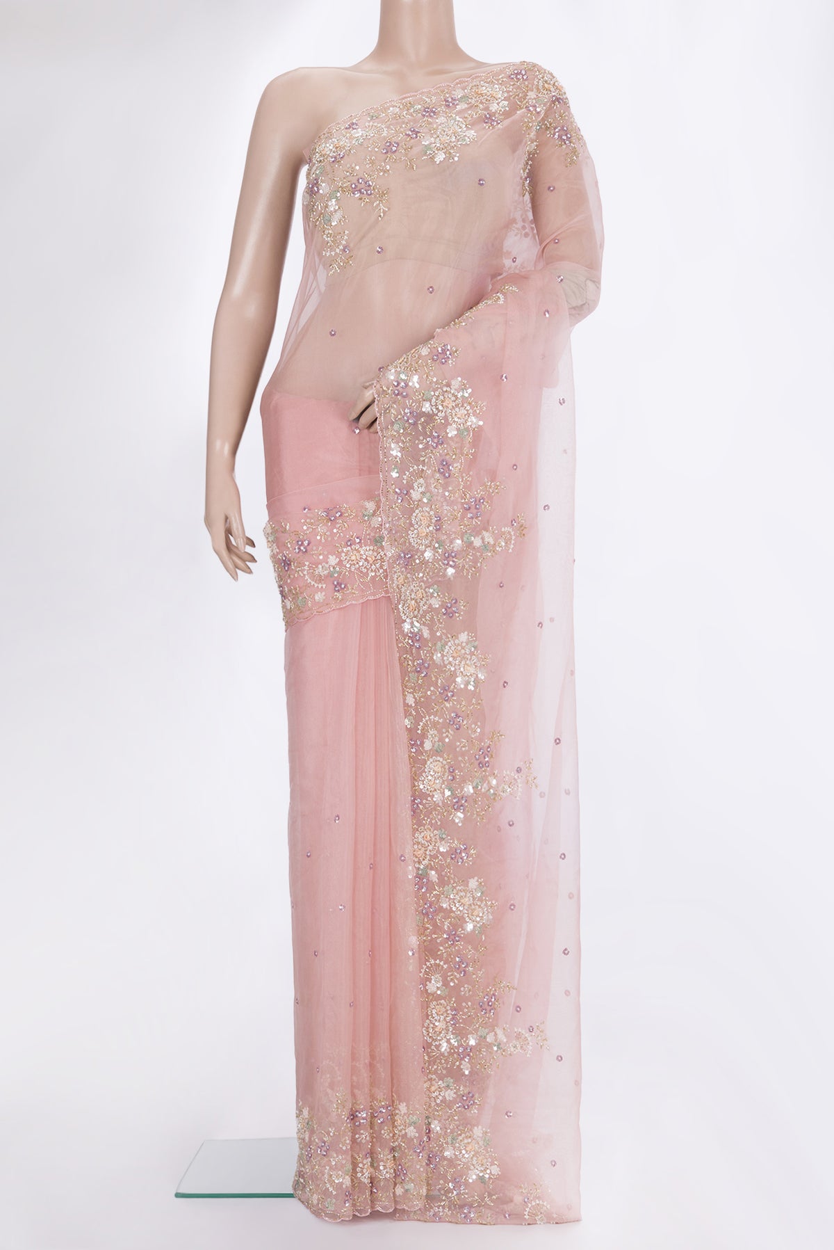 Golden Peach Organza Saree with Embroidered on the body and Sequin Border.  displayed on a mannequin