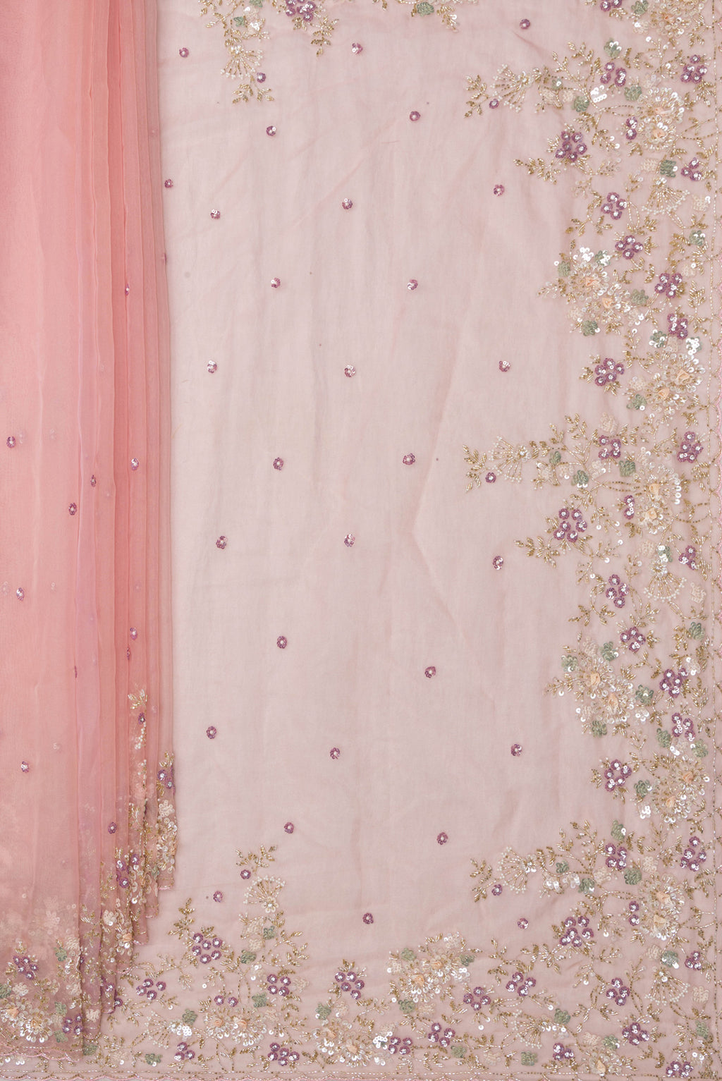 Pleats and pallu of Golden Peach Organza Saree with Embroidered on the body and Sequin Border. 