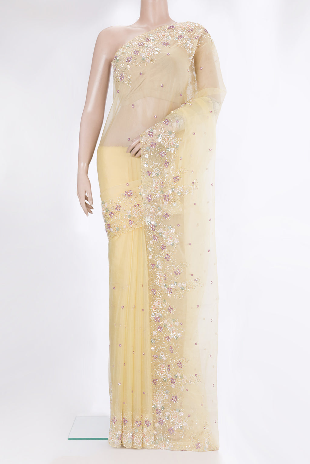 Sandal Organza Saree with Embroidery on the body and Sequin Border.  displayed on a mannequin