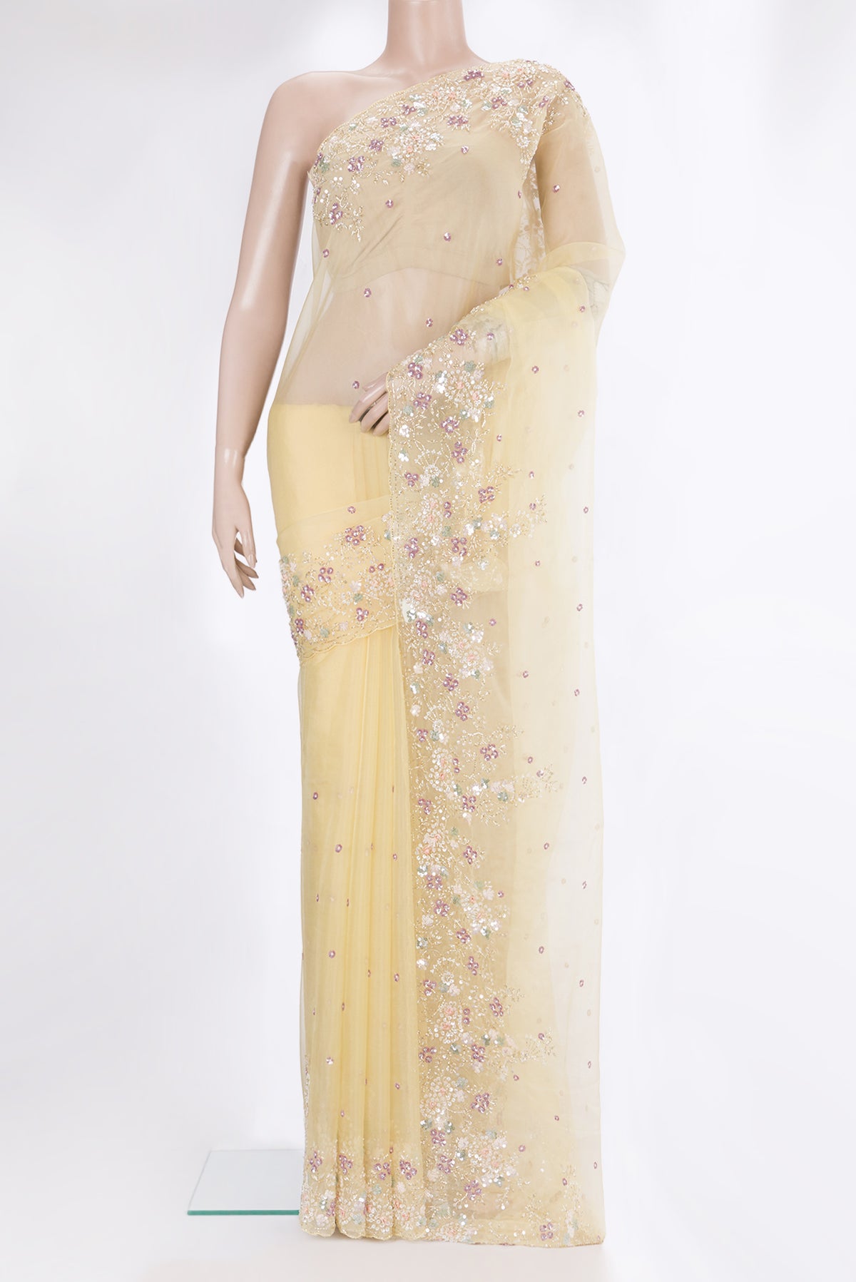 Sandal Organza Saree with Embroidery on the body and Sequin Border.  displayed on a mannequin