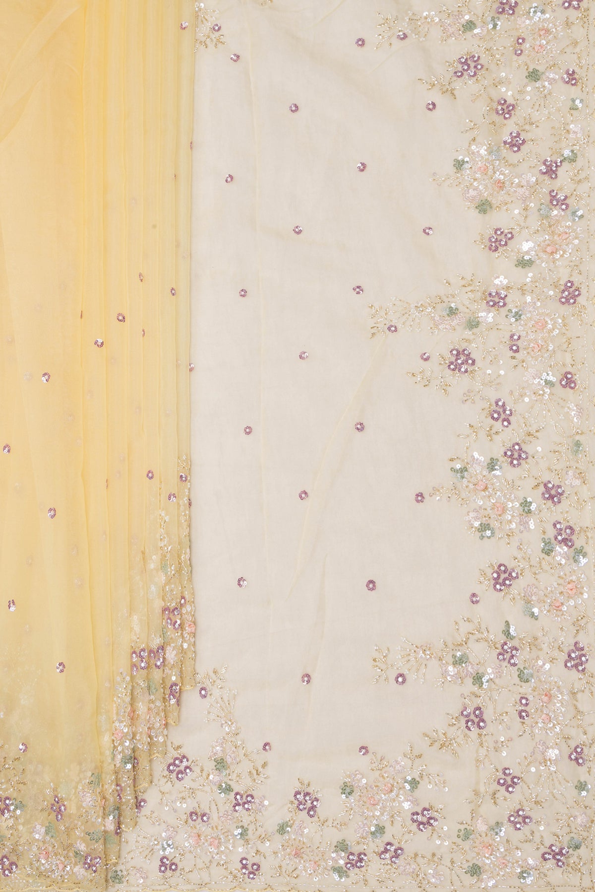 Pleats and pallu of Sandal Organza Saree with Embroidery on the body and Sequin Border. 