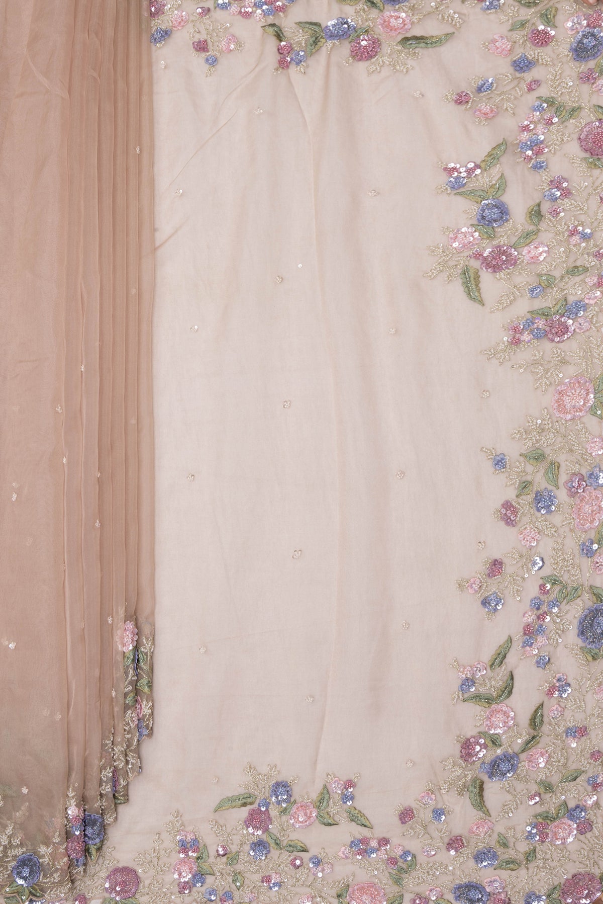 Pleats and pallu of Dark Beige Organza Saree with Embroidery on the body and Sequin Border. 