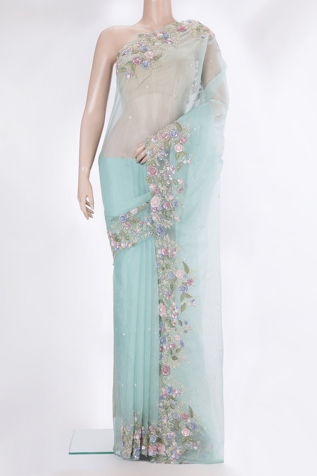 Light Blue Organza Saree with Embroidery on the body and Sequin Border.  displayed on a mannequin