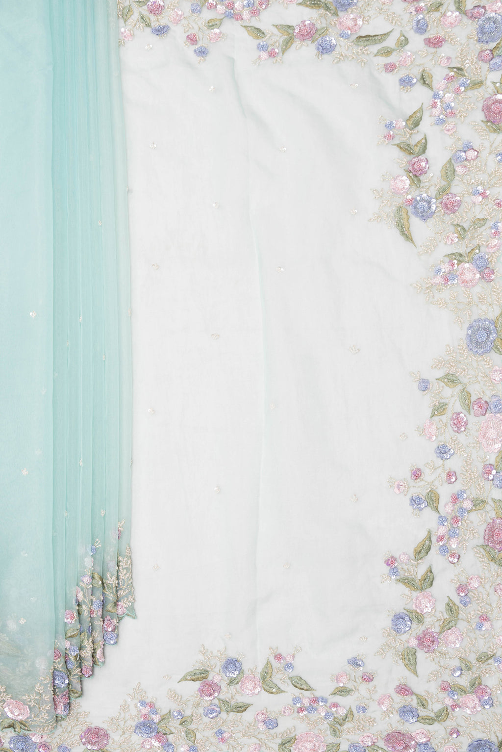 Pleats and pallu of Light Blue Organza Saree with Embroidery on the body and Sequin Border. 