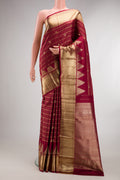 Pure Silk Maroon Kanchipuram Saree with Stripes on the body and Zari Border.  displayed on a mannequin