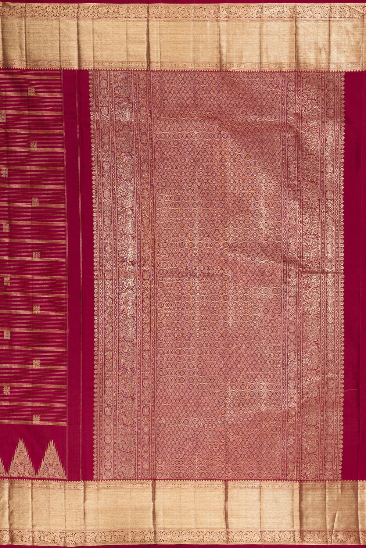 Close up image of the pallu of Pure Silk Maroon Kanchipuram Saree with Stripes on the body and Zari Border. 