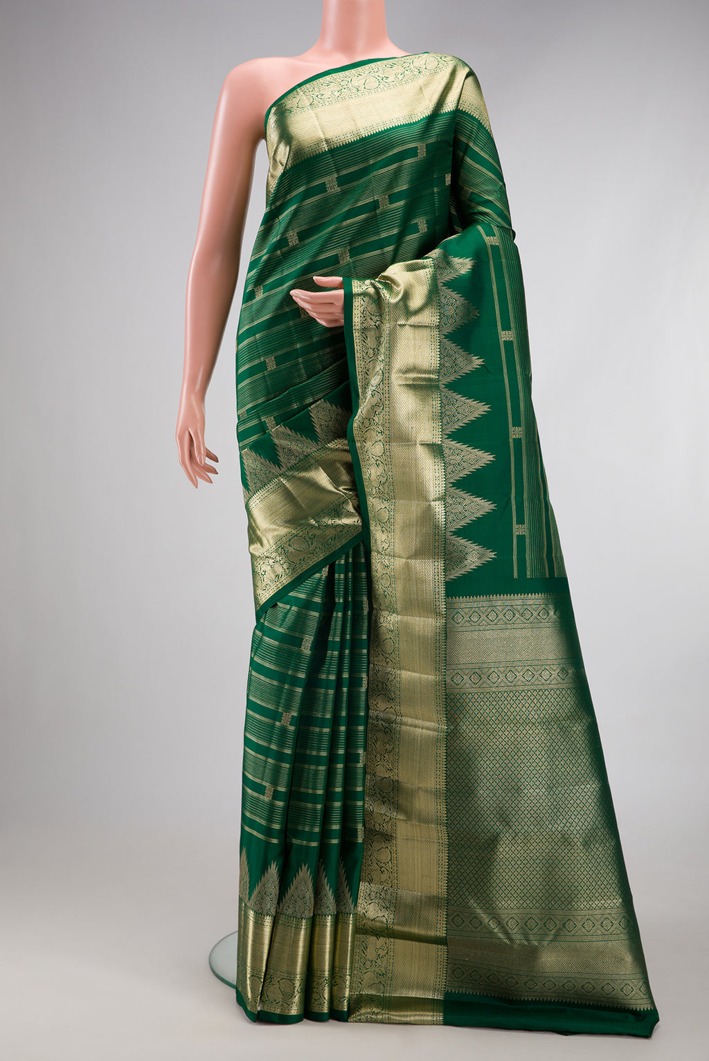Bottle Green Kanchipuram Silk Saree with Stripes on the body and Fancy Border.  displayed on a mannequin