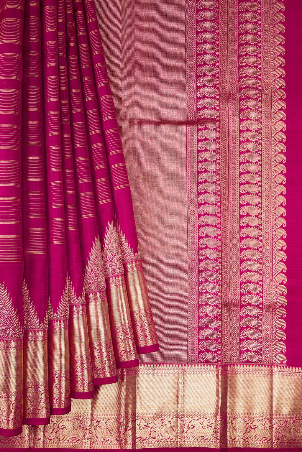 Pleats and pallu of Magenta Kanchipuram Silk Saree with Stripes on the body and Fancy Border. 