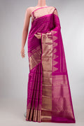 Pure Silk Rani Pink Kanchipuram Saree with Stripes on the body and Zari Border.  displayed on a mannequin