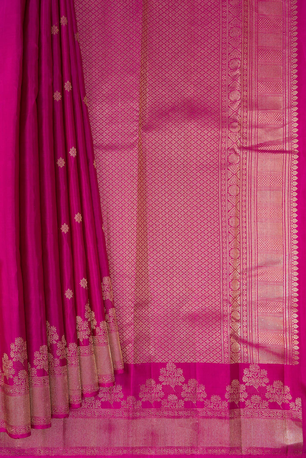 Pleats and pallu of Pure Silk Magenta Kanjivaram Saree with Zari Butta on the body and Fancy Border. 