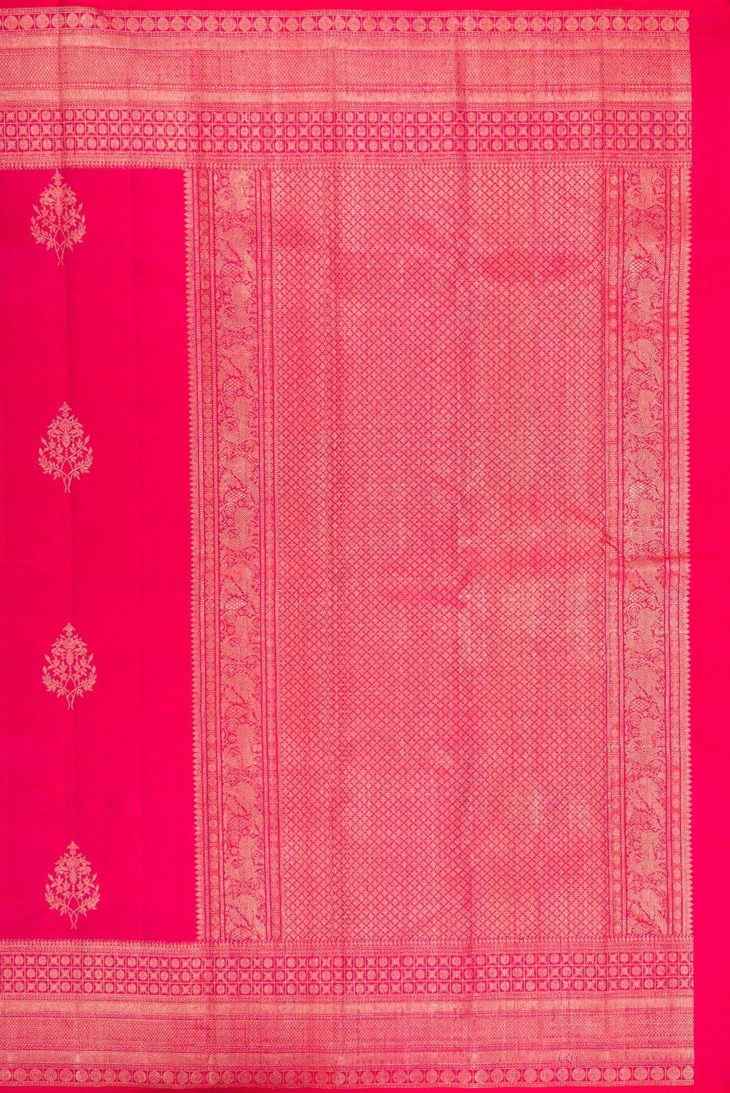 Close up image of the pallu of Dark Pink Kanjivaram Silk Saree with Zari Butta on the body and Zari Border. 