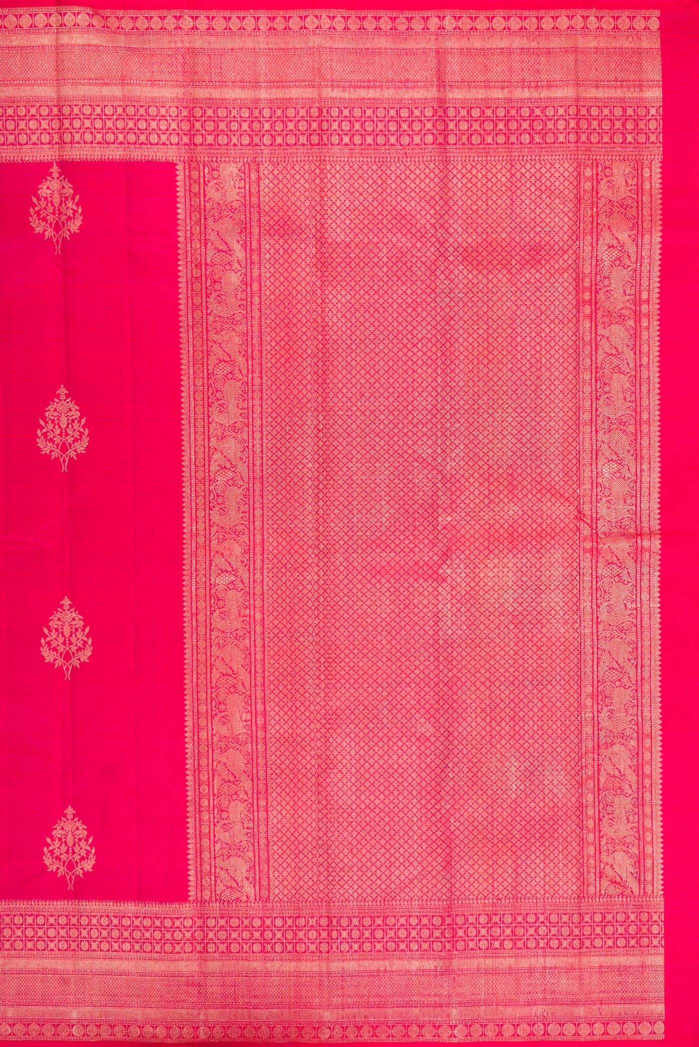 Close up image of the pallu of Dark Pink Kanjivaram Silk Saree with Zari Butta on the body and Zari Border. 