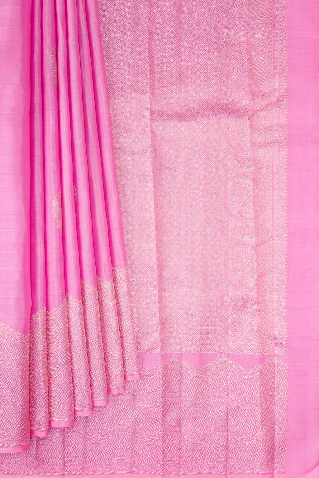 Pleats and pallu of Rose pink Kanjivaram Silk Saree with Zari Butta on the body and Fancy Border. 