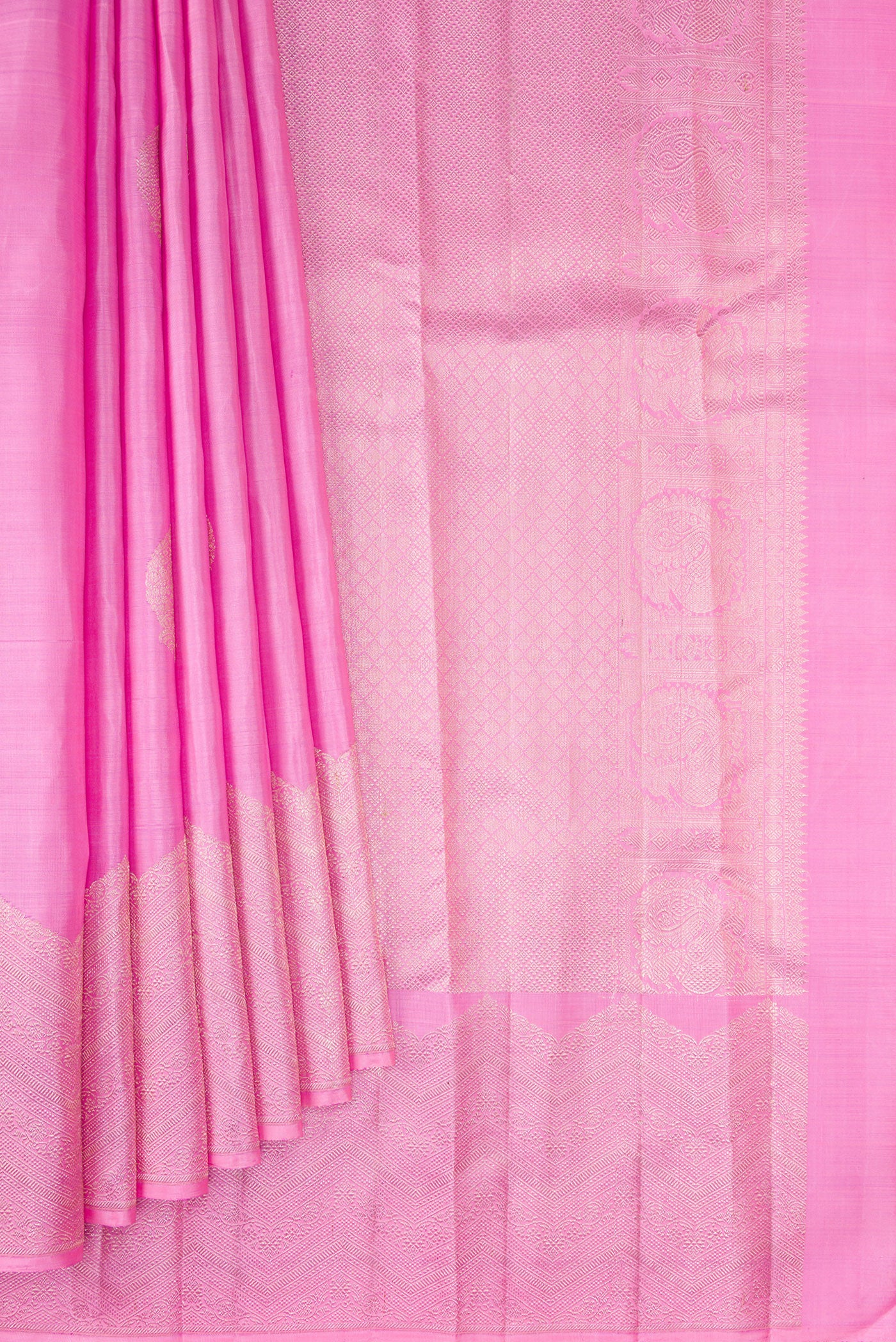 Pleats and pallu of Rose pink Kanjivaram Silk Saree with Zari Butta on the body and Fancy Border. 