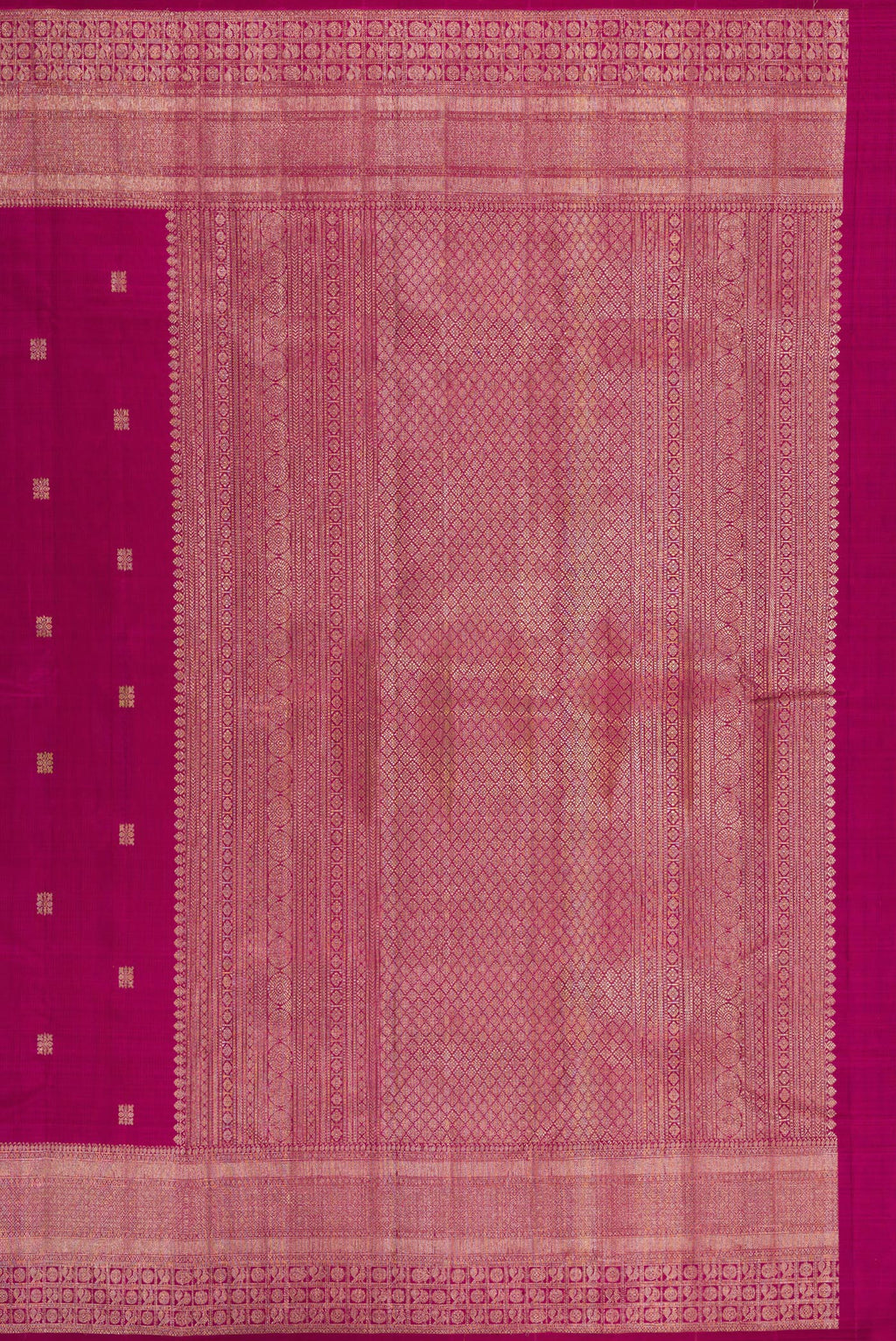 Close up image of the pallu of Magenta Kanjivaram Silk Saree with Zari Butta on the body and Fancy Border. 