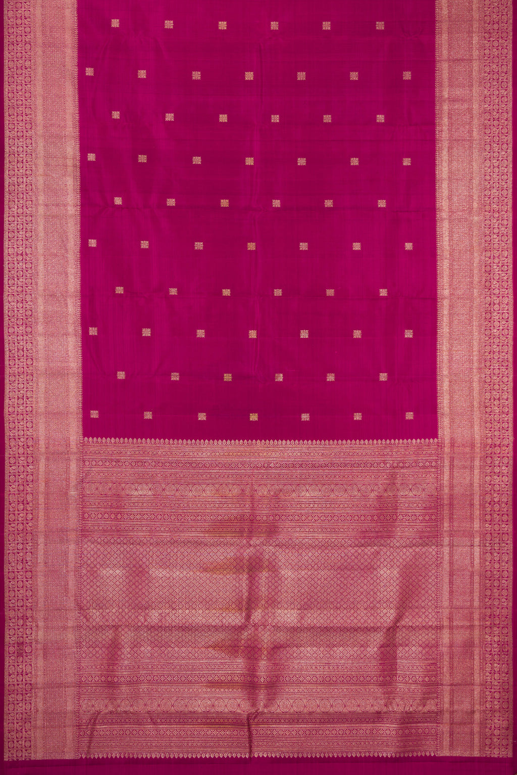 Flat view of Magenta Kanjivaram Silk Saree with Zari Butta on the body and Fancy Border. 