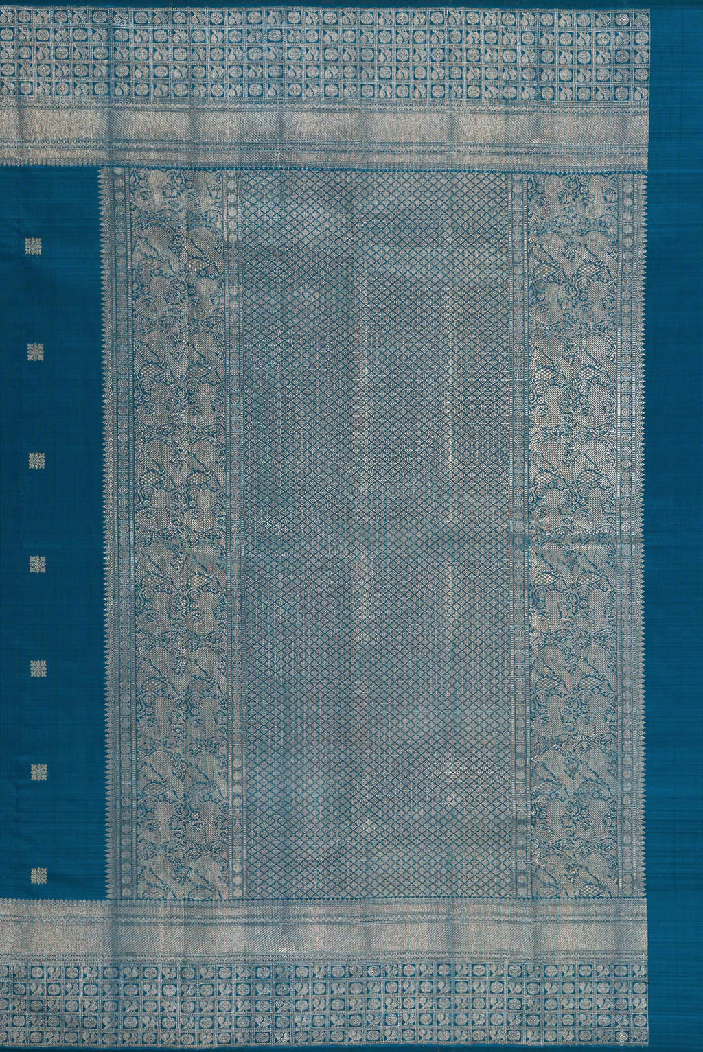Close up image of the pallu of Pure Silk Peacock Blue Kanjivaram Saree with Zari Butta on the body and Fancy Border. 