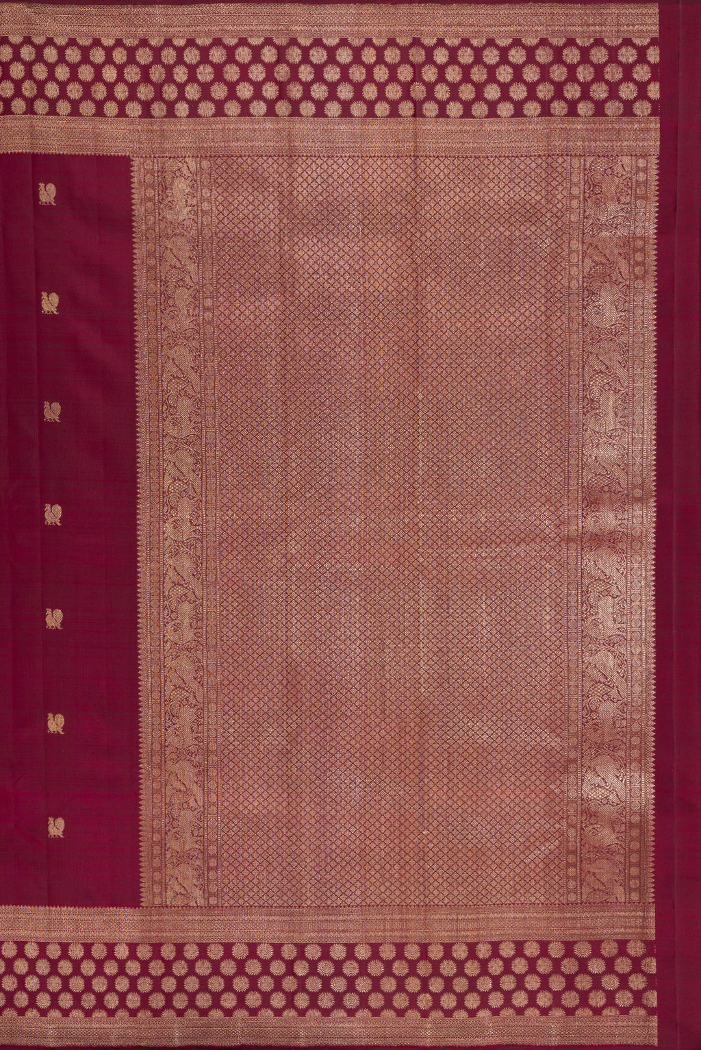 Close up image of the pallu of Maroon Kanjivaram Silk Saree with Zari Butta on the body and Fancy Border. 