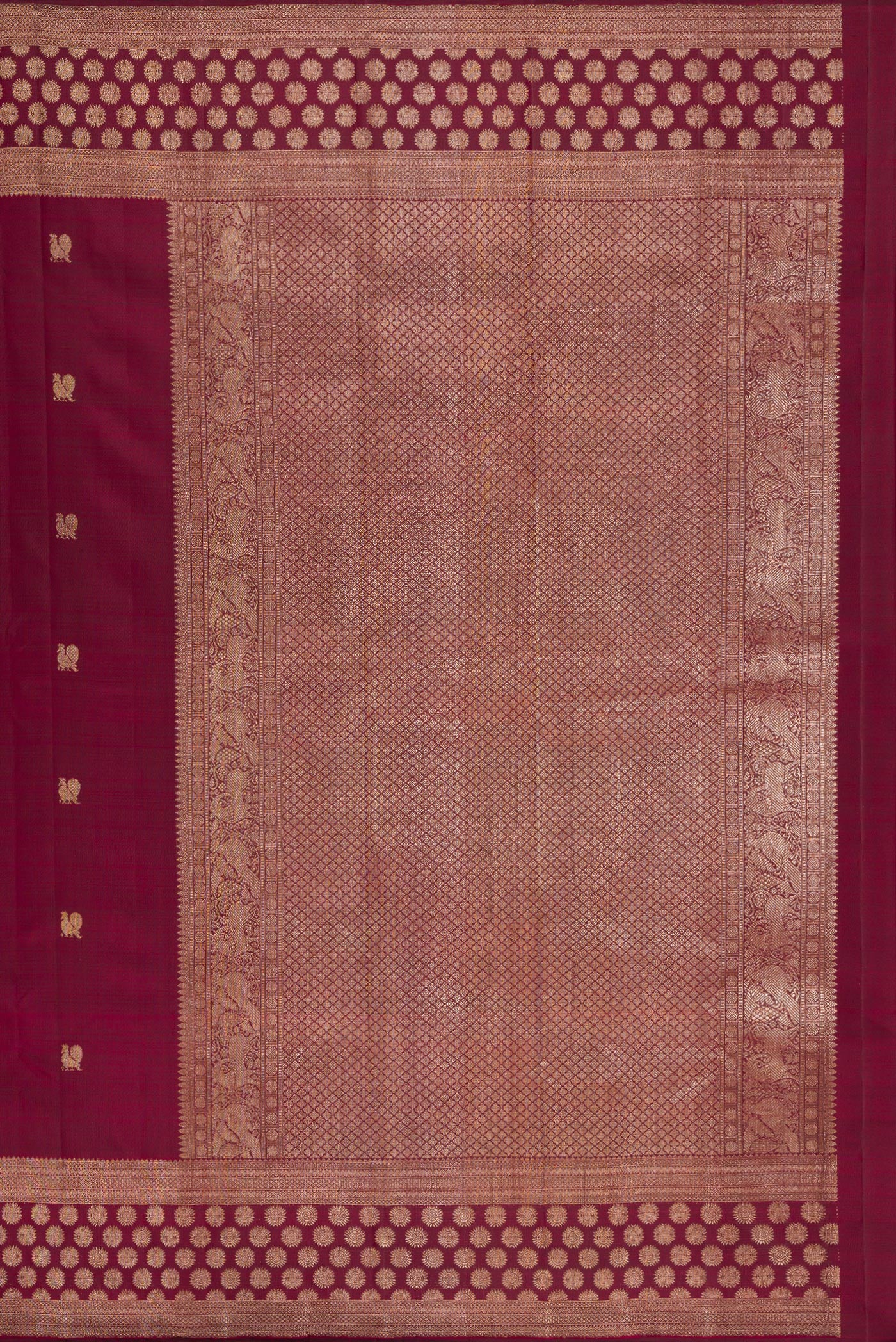 Close up image of the pallu of Maroon Kanjivaram Silk Saree with Zari Butta on the body and Fancy Border. 