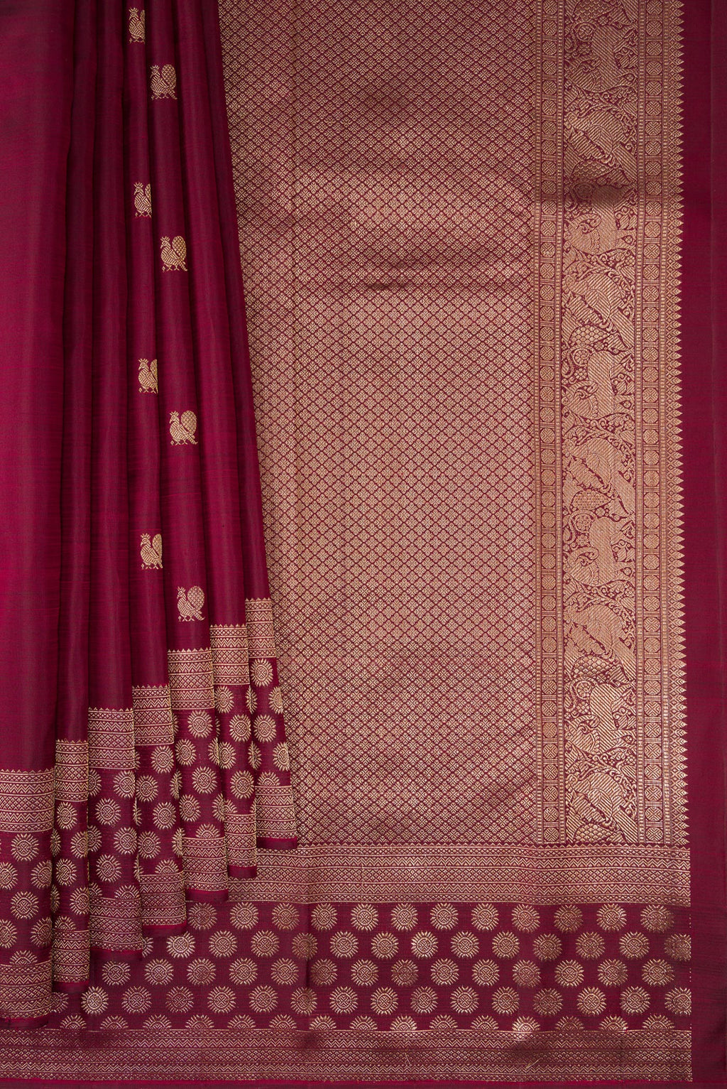 Pleats and pallu of Maroon Kanjivaram Silk Saree with Zari Butta on the body and Fancy Border. 