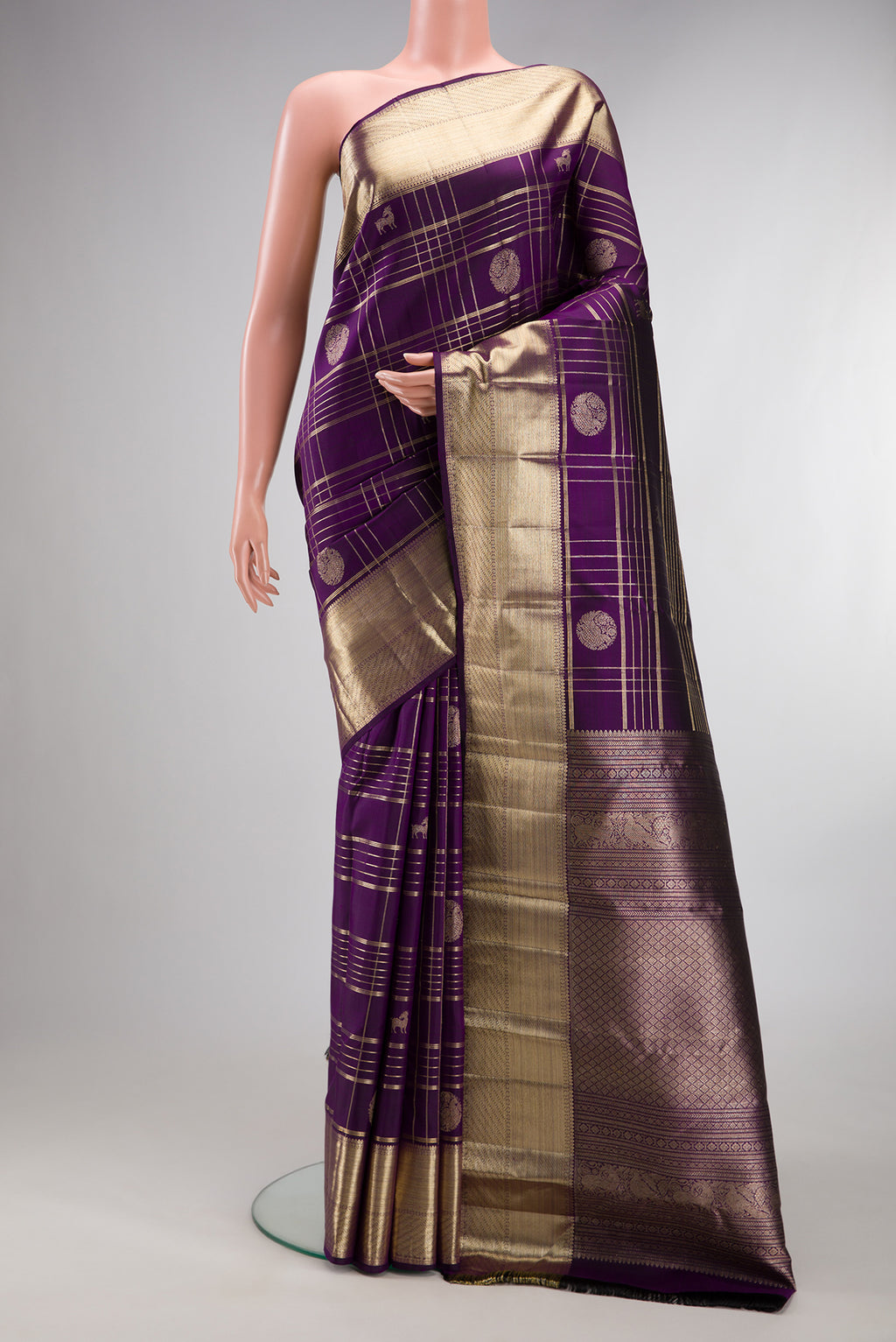 Pure Silk Violet Kanchipuram Saree with Checked design on the body and Zari Border.  displayed on a mannequin