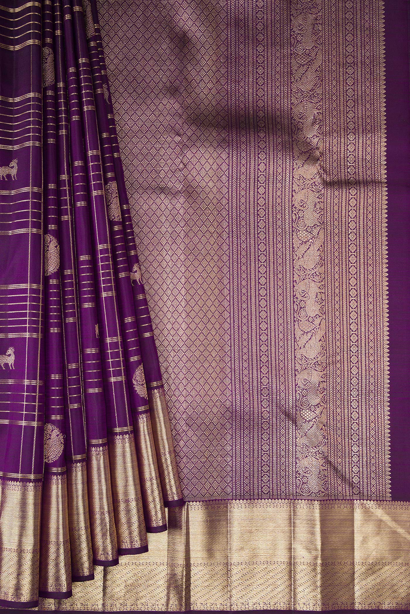 Pleats and pallu of Pure Silk Violet Kanchipuram Saree with Checked design on the body and Zari Border. 