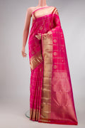 Rani Pink Kanchipuram Silk Saree with Checked design on the body and Zari Border.  displayed on a mannequin
