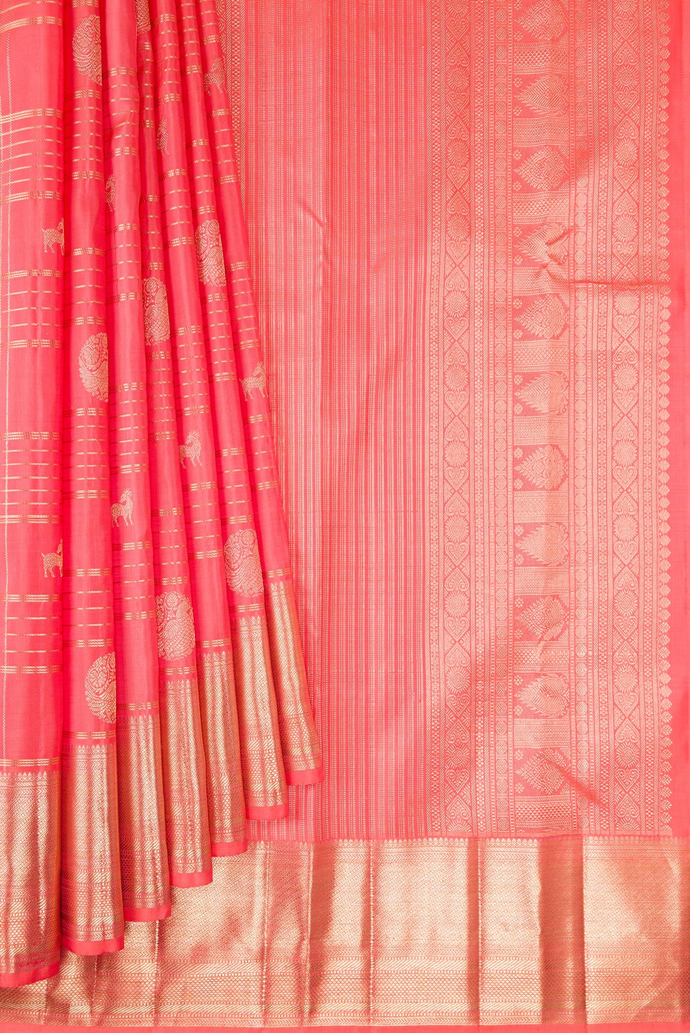 Pleats and pallu of Coral Kanchipuram Silk Saree with Checked design on the body and Zari Border. 