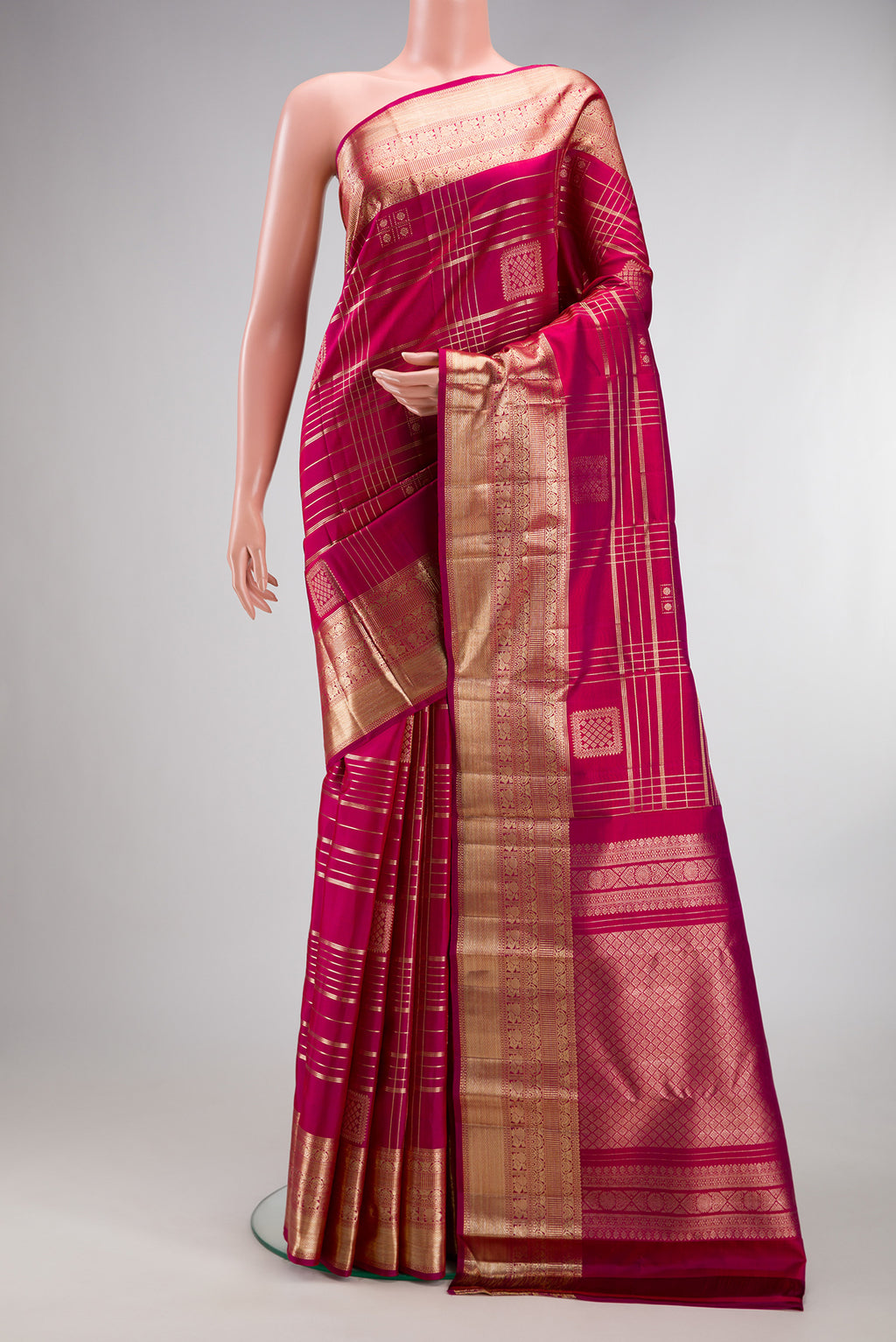 Pure Silk Dark Pink Kanchipuram Saree with Checked design on the body and Zari Border.  displayed on a mannequin
