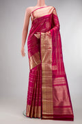 Pure Silk Dark Pink Kanchipuram Saree with Checked design on the body and Zari Border.  displayed on a mannequin