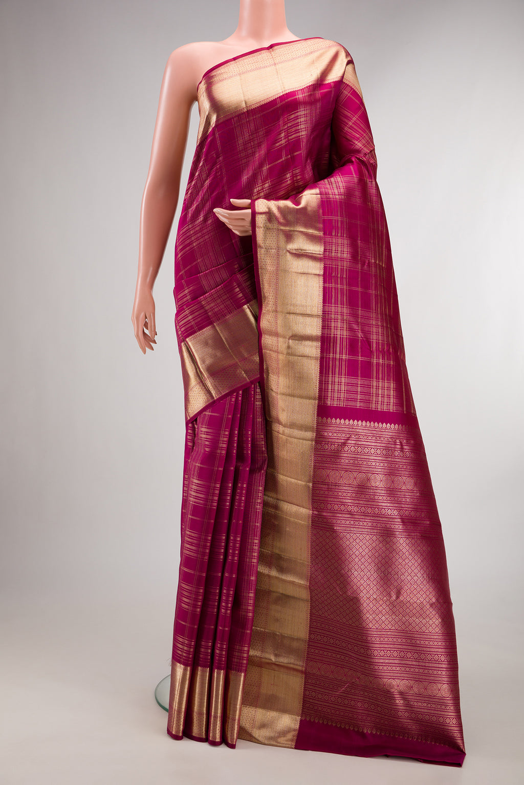 Pure Silk Dark Pink Kanchipuram Saree with Checked design on the body and Zari Border.  displayed on a mannequin