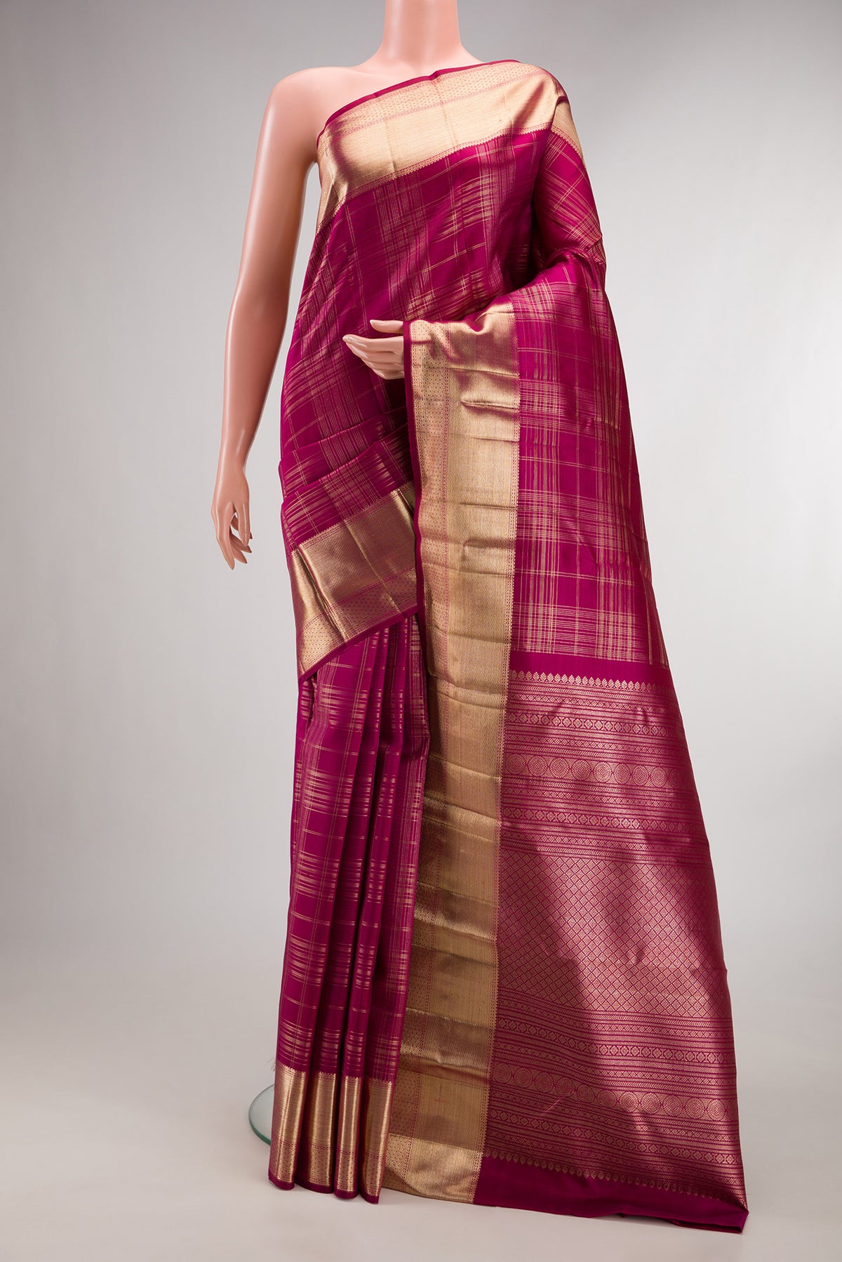 Pure Silk Dark Pink Kanchipuram Saree with Checked design on the body and Zari Border.  displayed on a mannequin