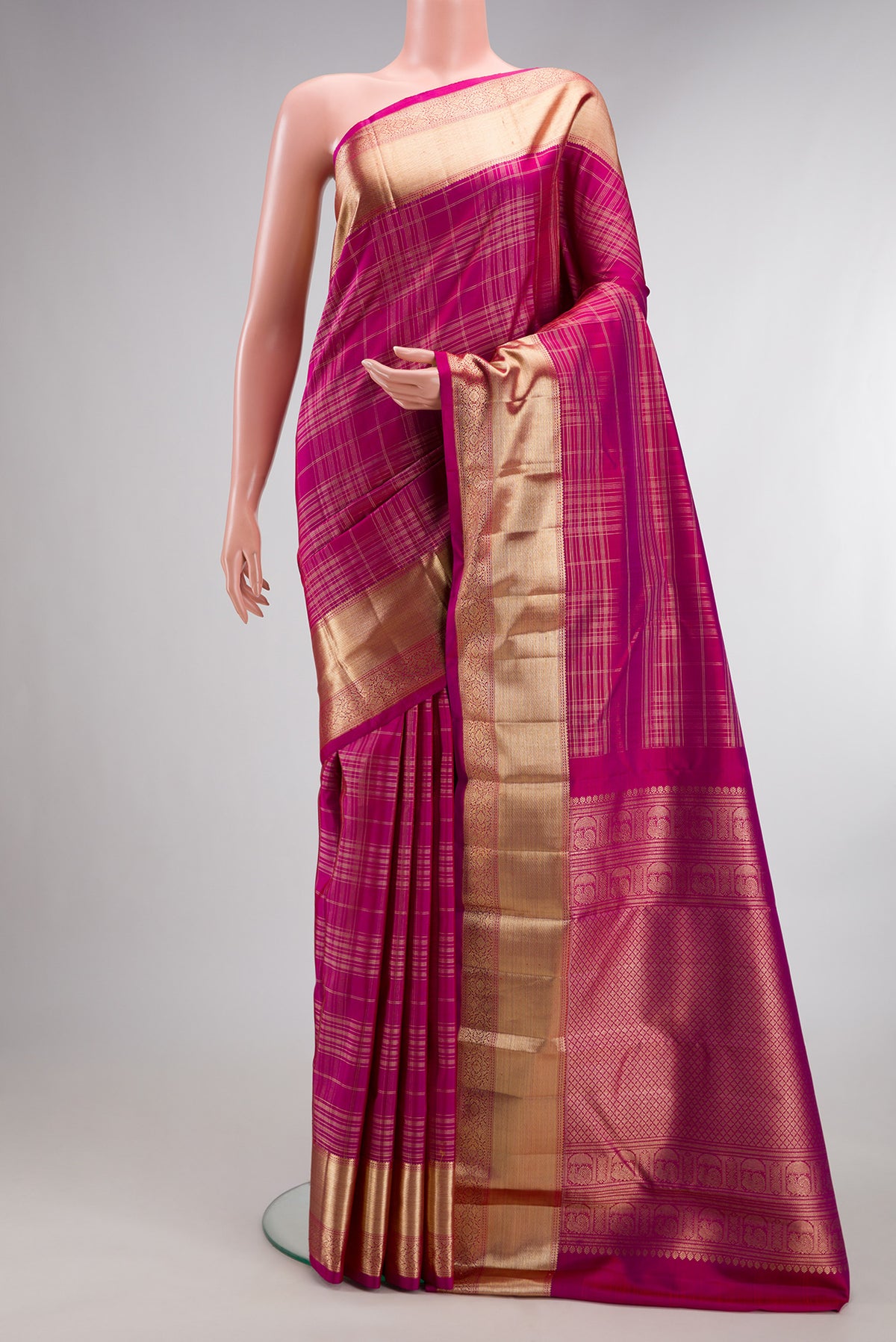 Pure Silk Dark Pink Kanchipuram Saree with Checked design on the body and Zari Border.  displayed on a mannequin