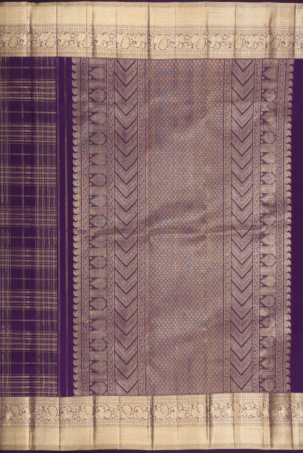 Close up image of the pallu of Violet Kanchipuram Silk Saree with Checked design on the body and Zari Border. 
