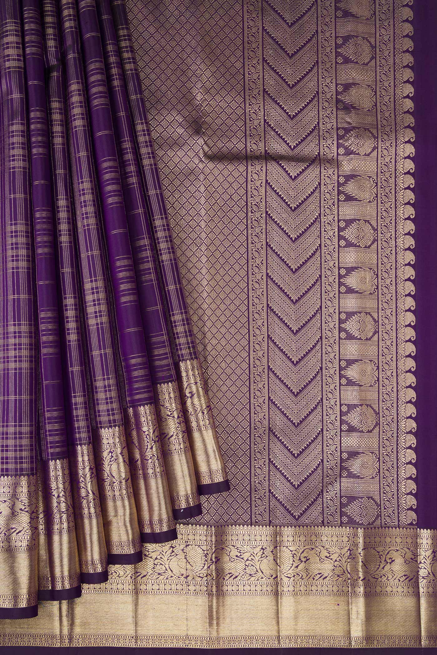 Pleats and pallu of Violet Kanchipuram Silk Saree with Checked design on the body and Zari Border. 