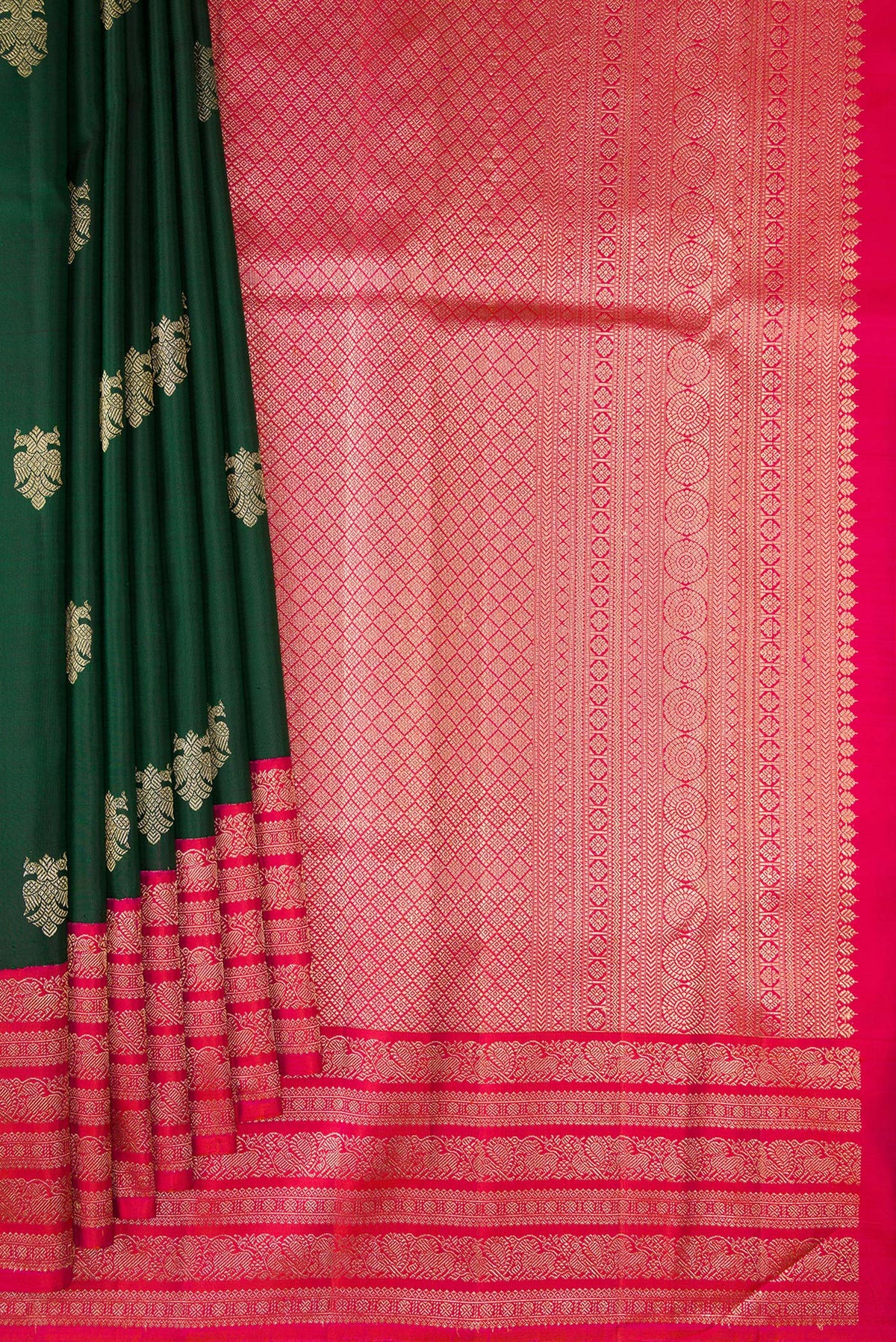 Pleats and pallu of Pure Silk Bottle Green Kanchipuram Saree with Zari Butta on the body and Zari Border. 