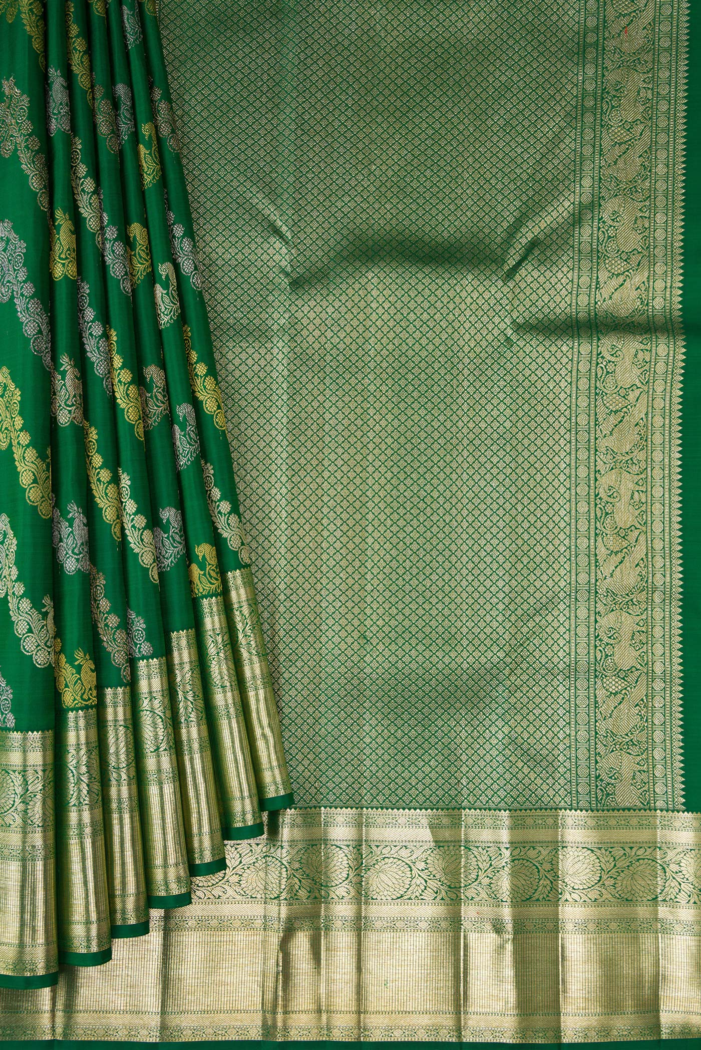 Pleats and pallu of Green Kanchipuram Silk Saree with Zari Brocade on the body and Zari Border. 