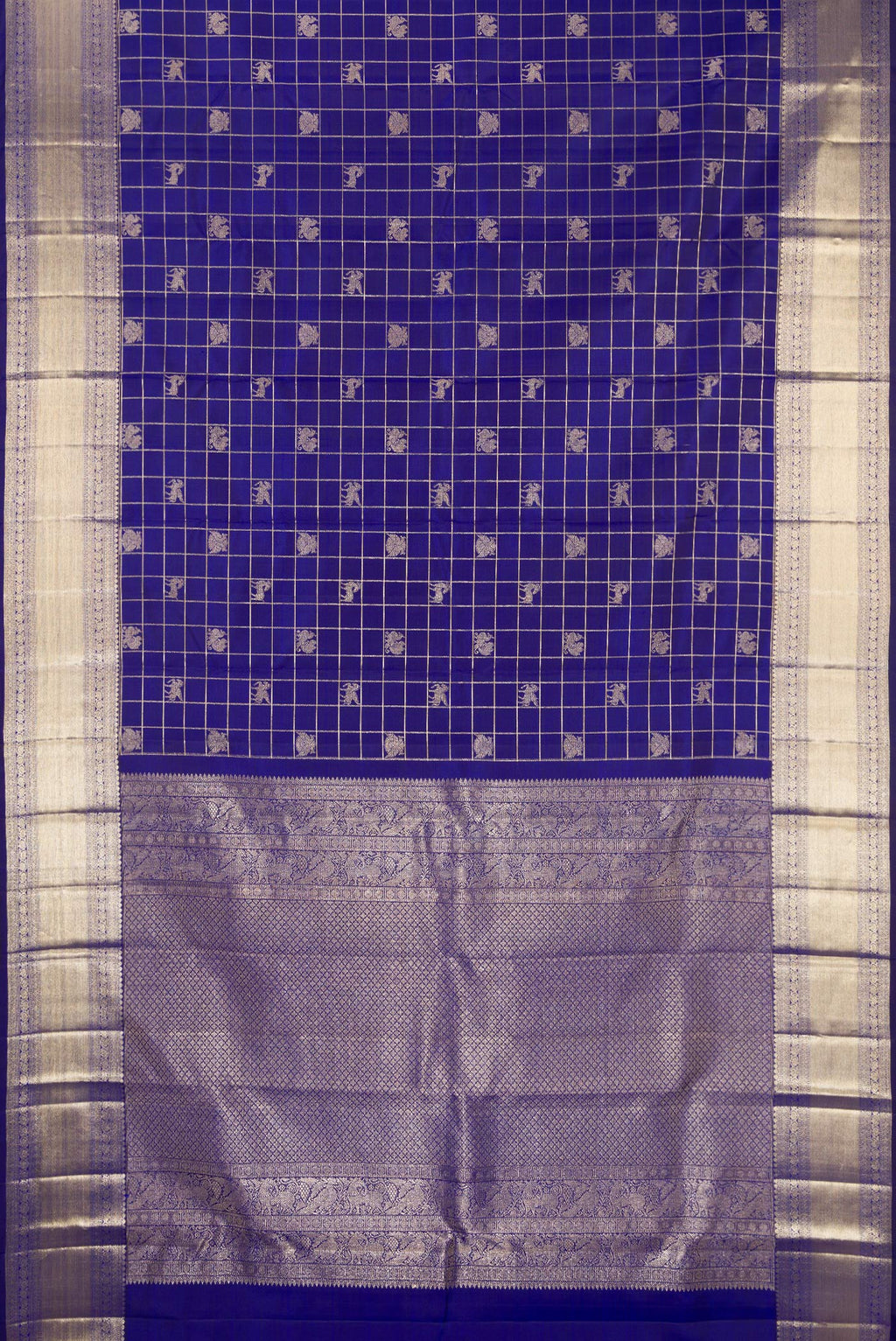 Flat view of Royal Blue Kanchipuram Silk Saree with Checked design on the body and Zari Border. 