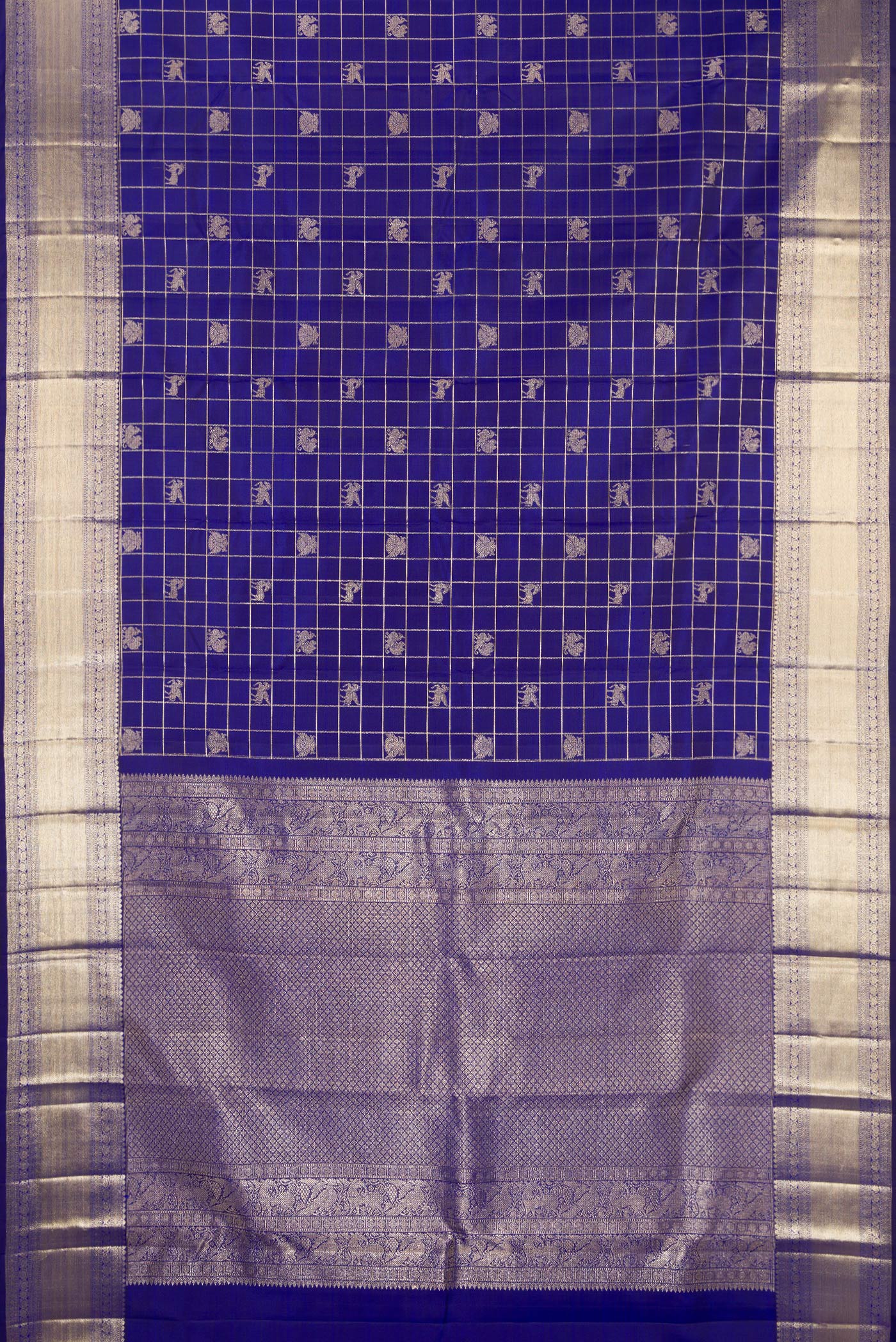 Flat view of Royal Blue Kanchipuram Silk Saree with Checked design on the body and Zari Border. 