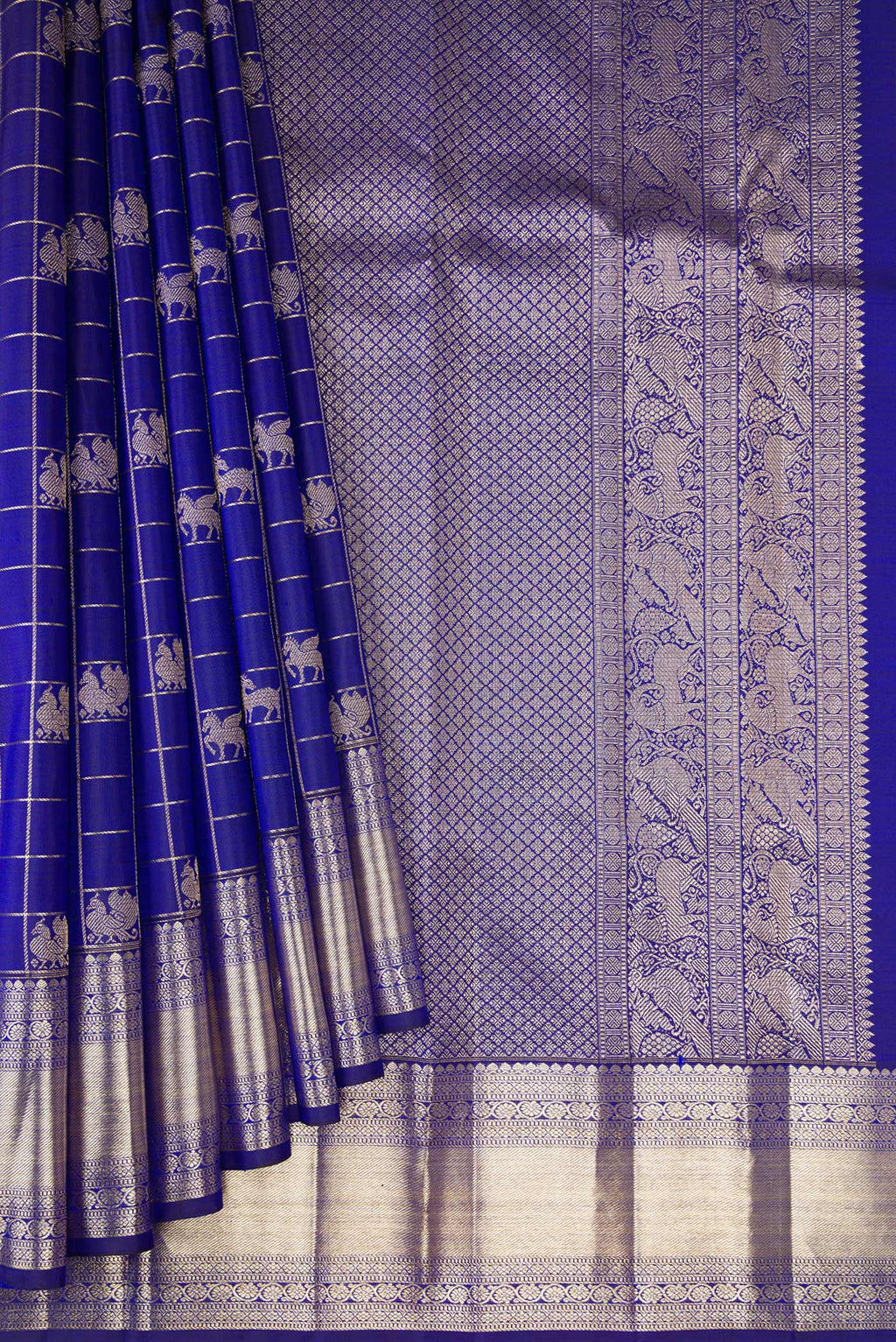 Pleats and pallu of Royal Blue Kanchipuram Silk Saree with Checked design on the body and Zari Border. 