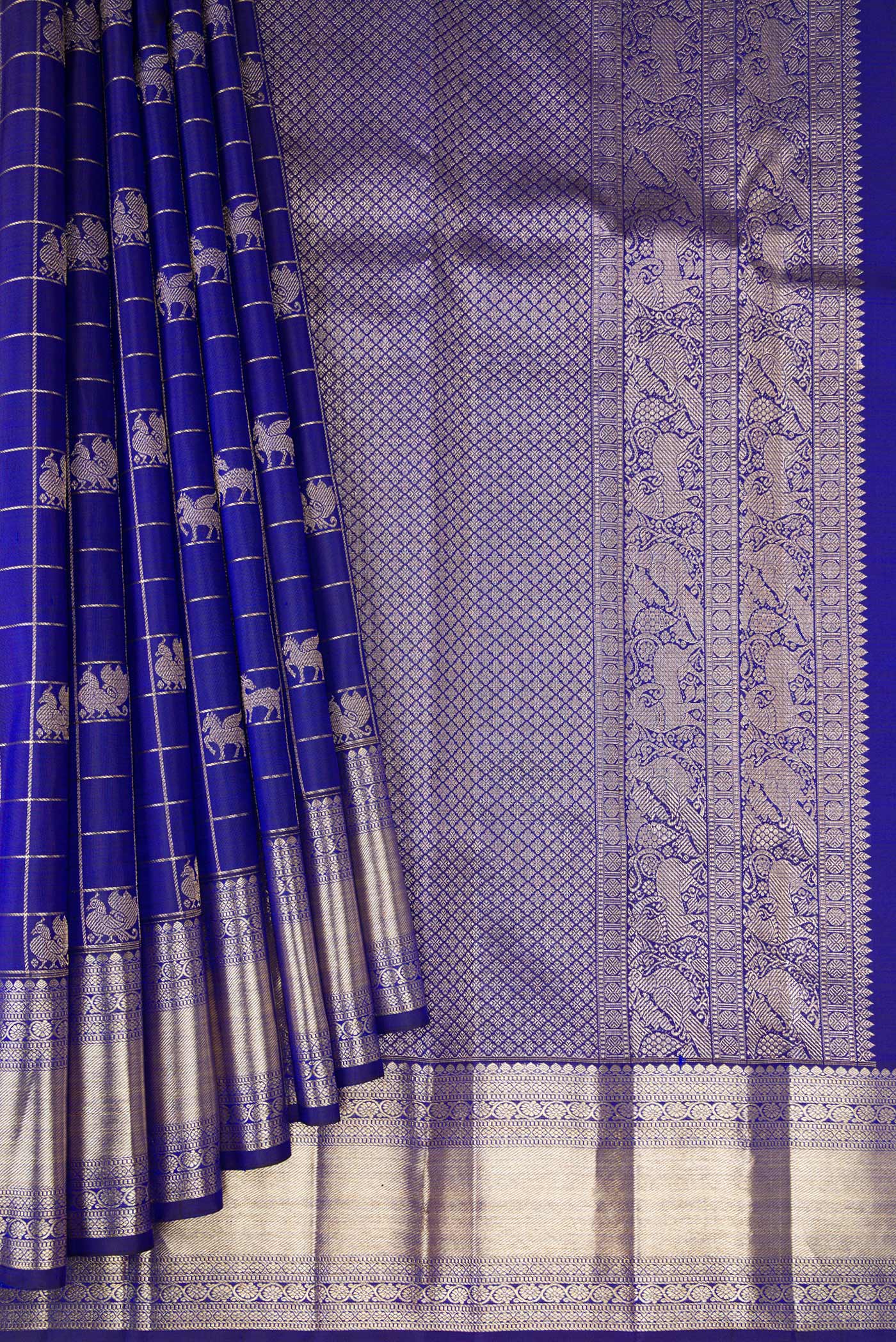 Pleats and pallu of Royal Blue Kanchipuram Silk Saree with Checked design on the body and Zari Border. 