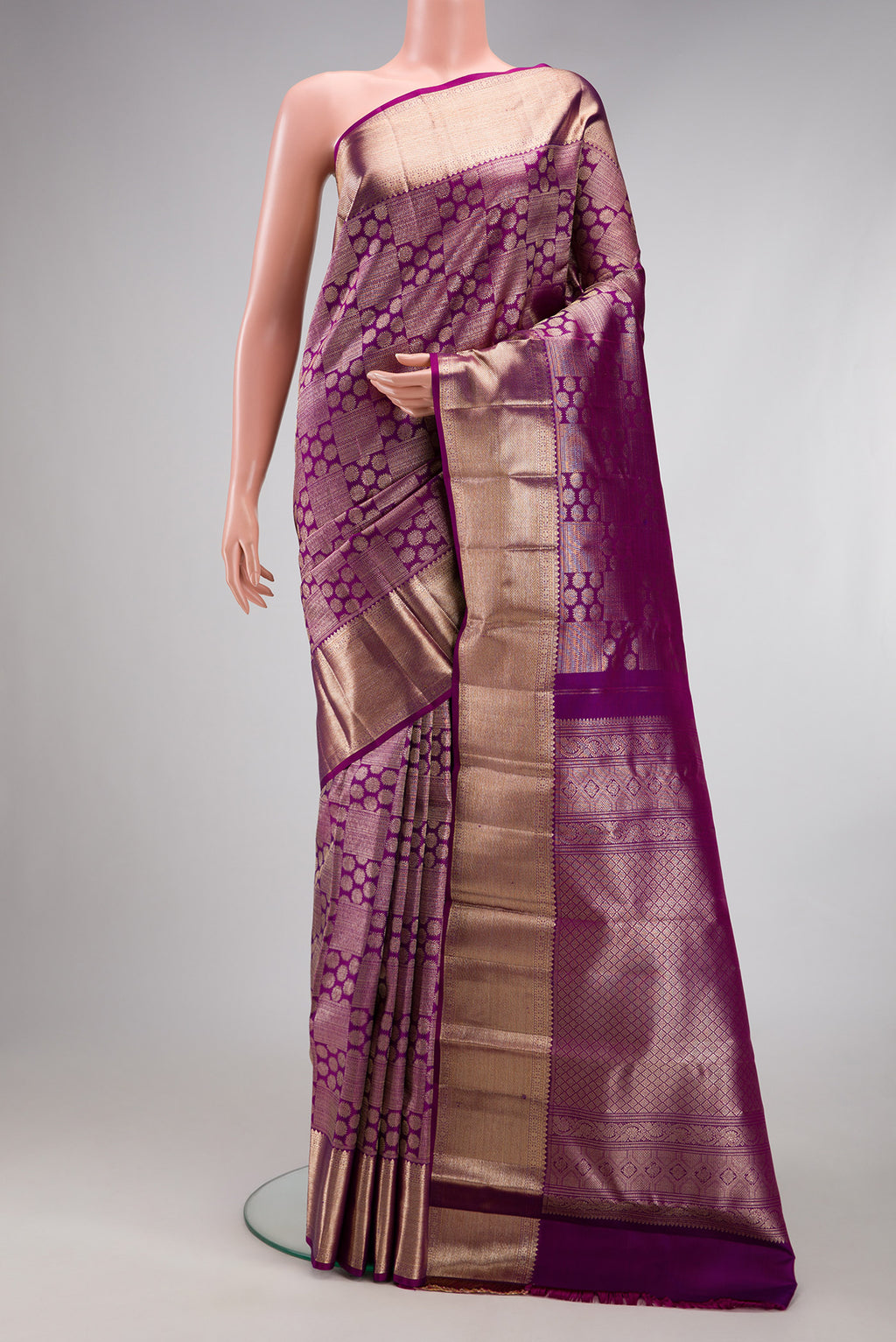 Purple Kanchipuram Silk Saree with Zari Brocade on the body and Zari Border.  displayed on a mannequin