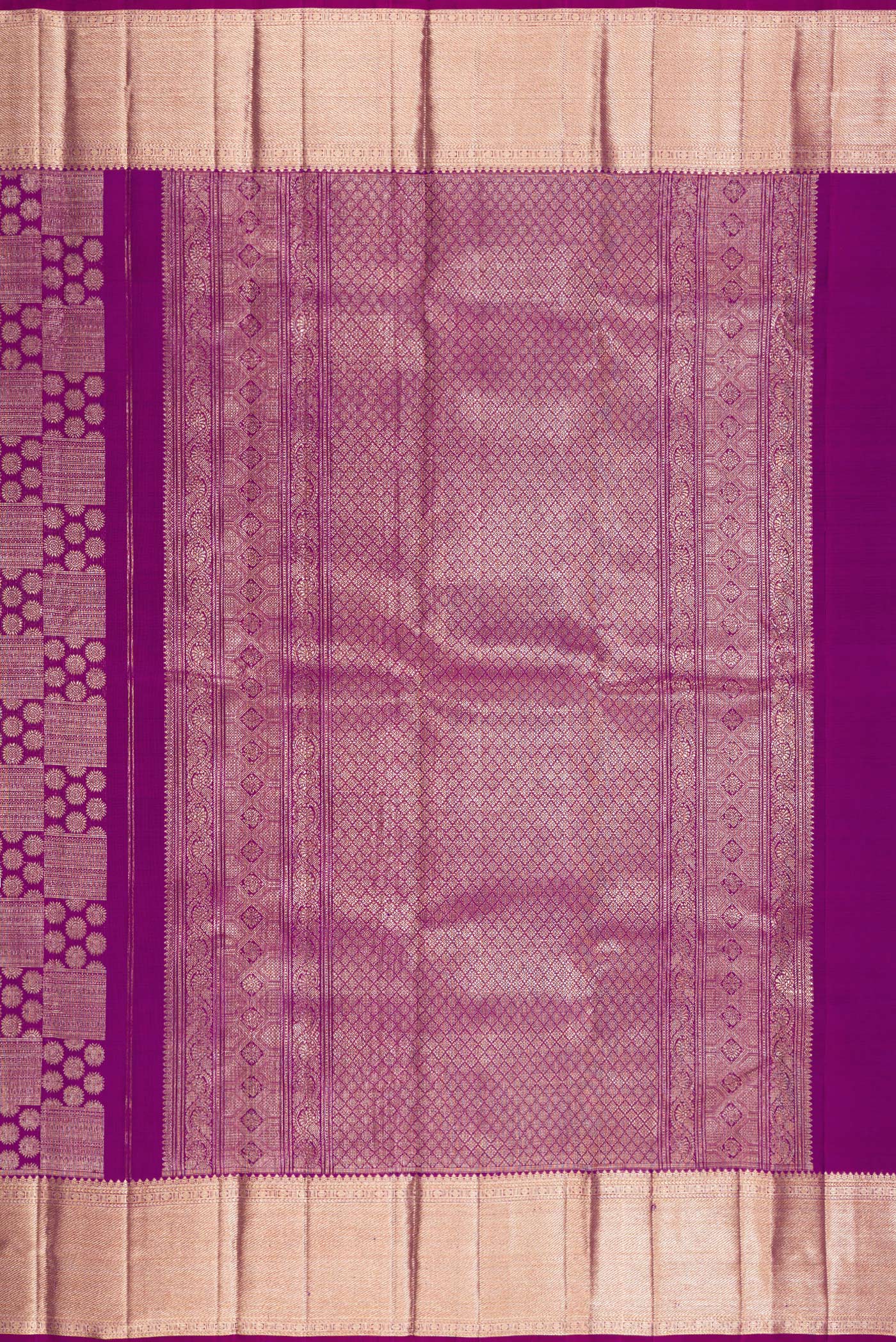 Close up image of the pallu of Purple Kanchipuram Silk Saree with Zari Brocade on the body and Zari Border. 
