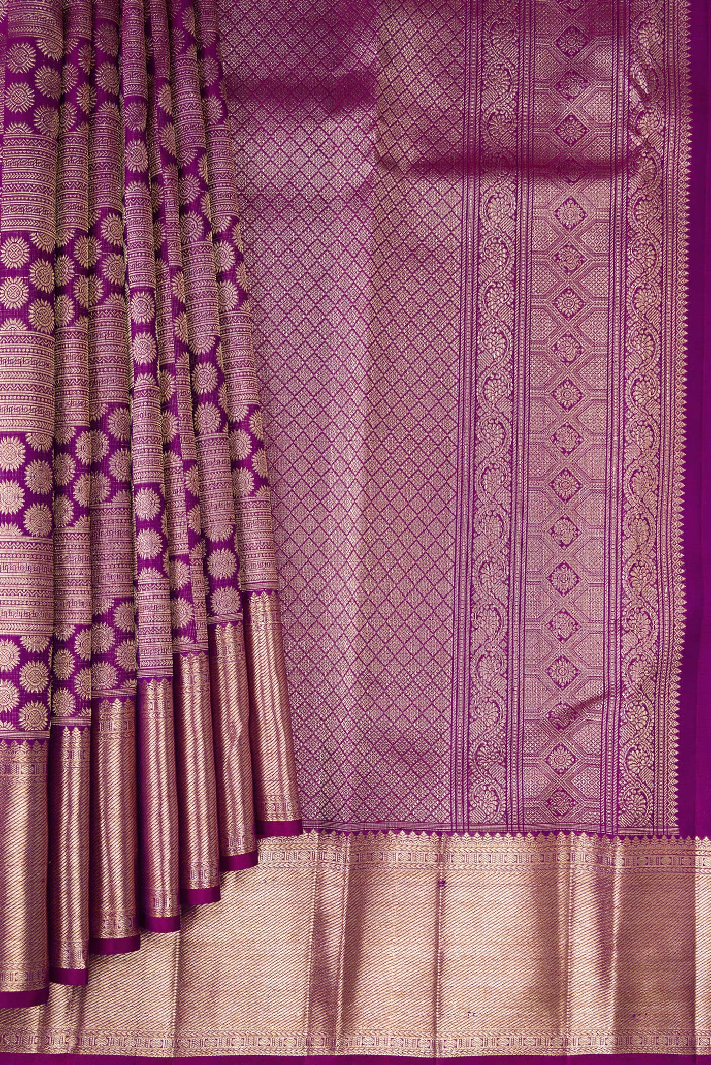 Pleats and pallu of Purple Kanchipuram Silk Saree with Zari Brocade on the body and Zari Border. 