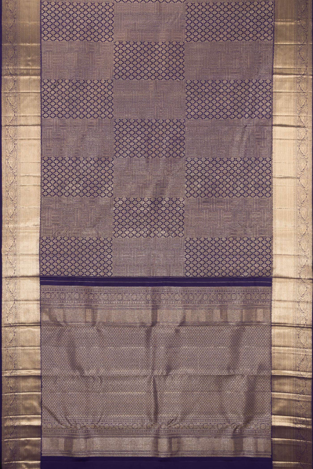 Flat view of Navy Blue Kanchipuram Silk Saree with Zari Brocade on the body and Zari Border. 