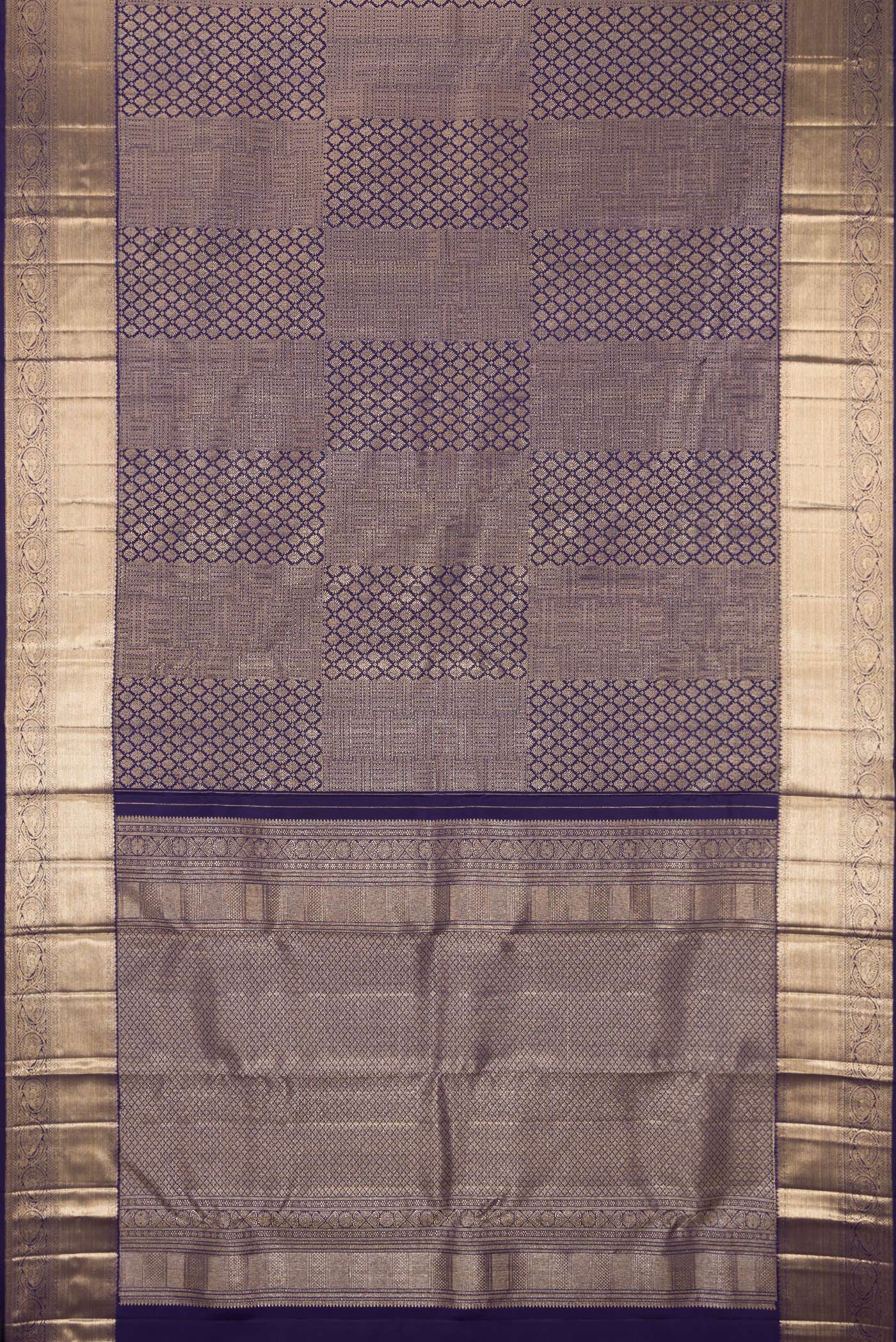 Flat view of Navy Blue Kanchipuram Silk Saree with Zari Brocade on the body and Zari Border. 